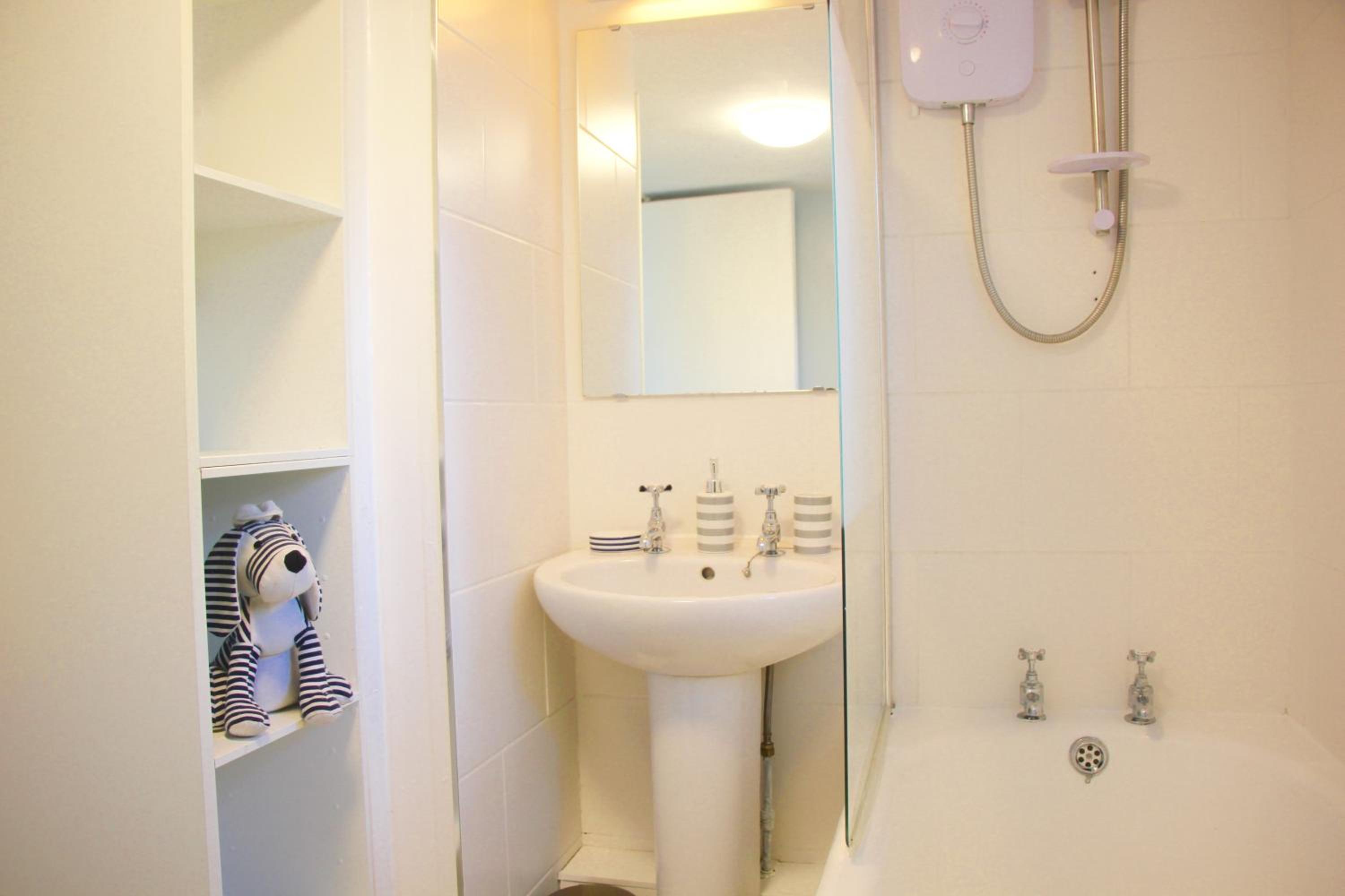 Three-Bedroom House - Photo 16