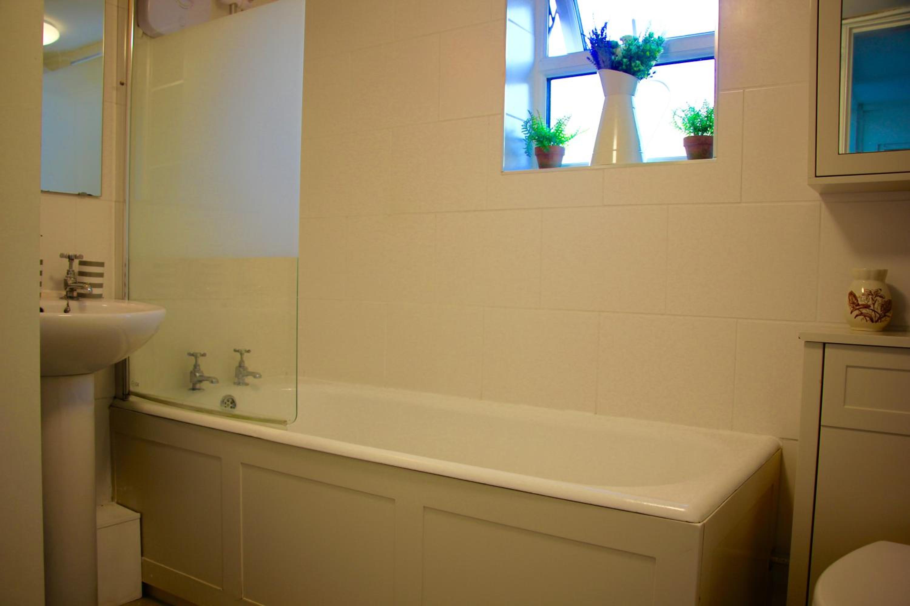 Three-Bedroom House - Photo 17