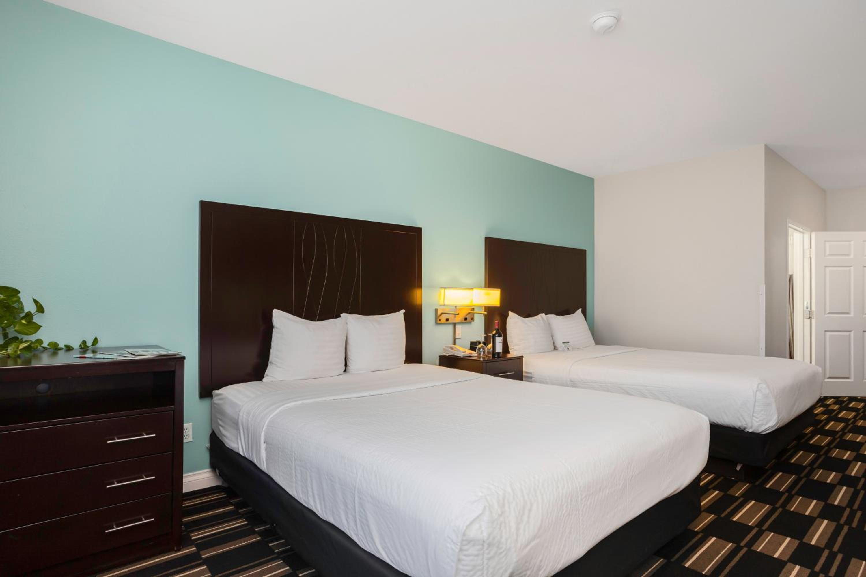 Standard Queen Room with Two Queen Beds - Photo 1