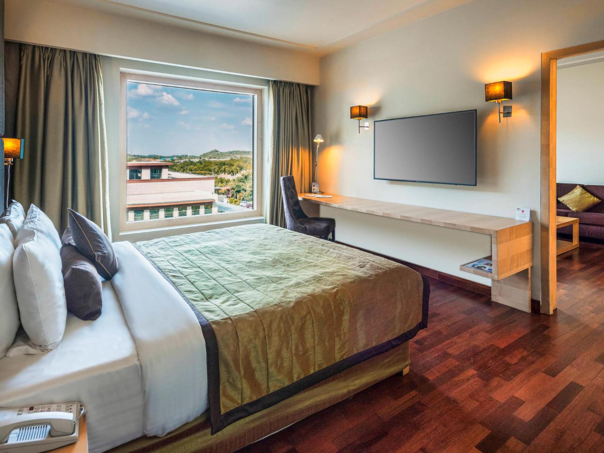 Deluxe Queen Suite With Two Way Airport Transfer, Privileged Access To Executive Lounge With Drinks (Selected Imfl) And Snacks From 6-8 Pm Deluxe Queen Suite With Two Way Airport Transfer, Privileged Access To Executive Lounge With Drinks (Selected Imfl) And Snacks From 6-8 Pm