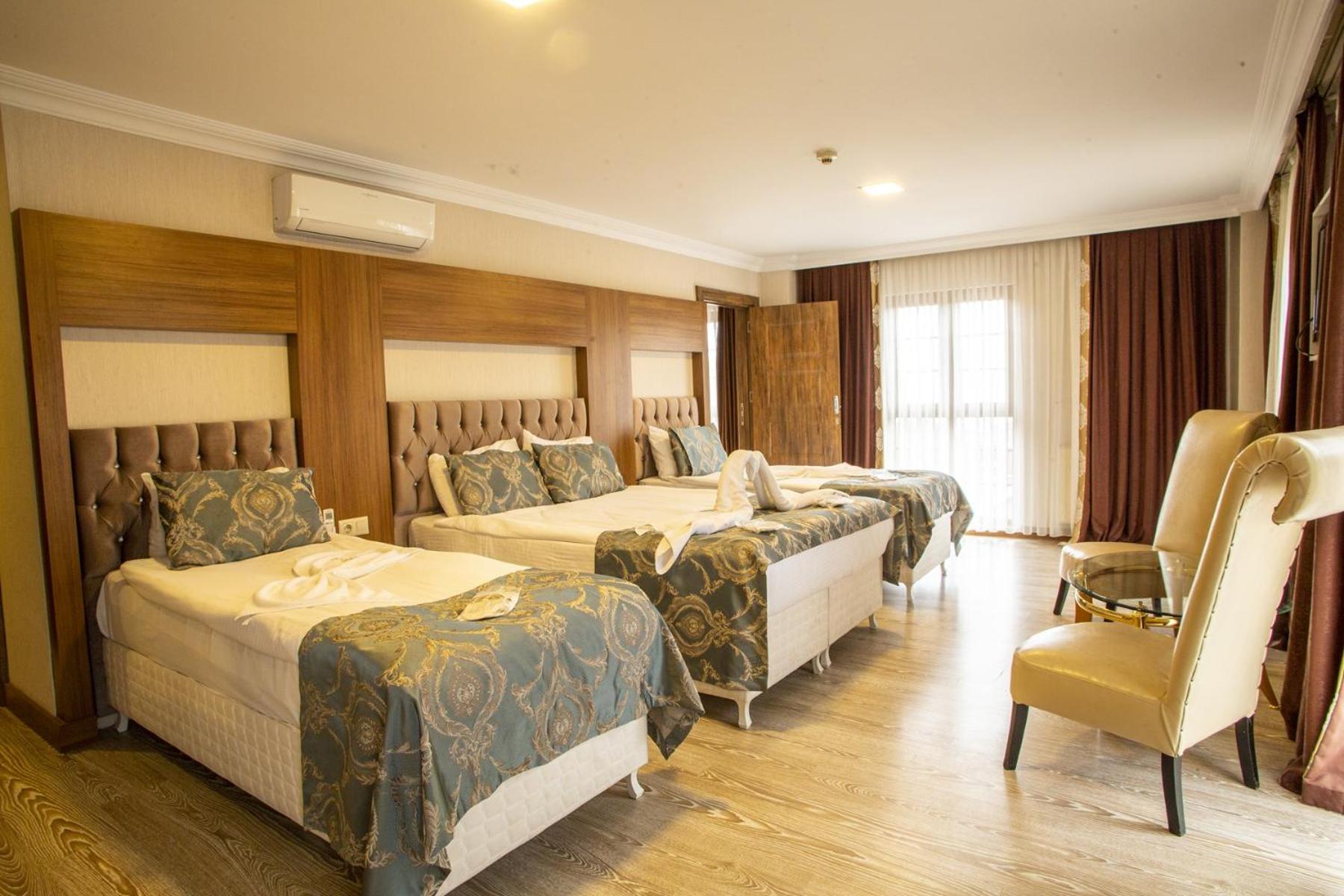 Deluxe Quadruple Room - Photo 4