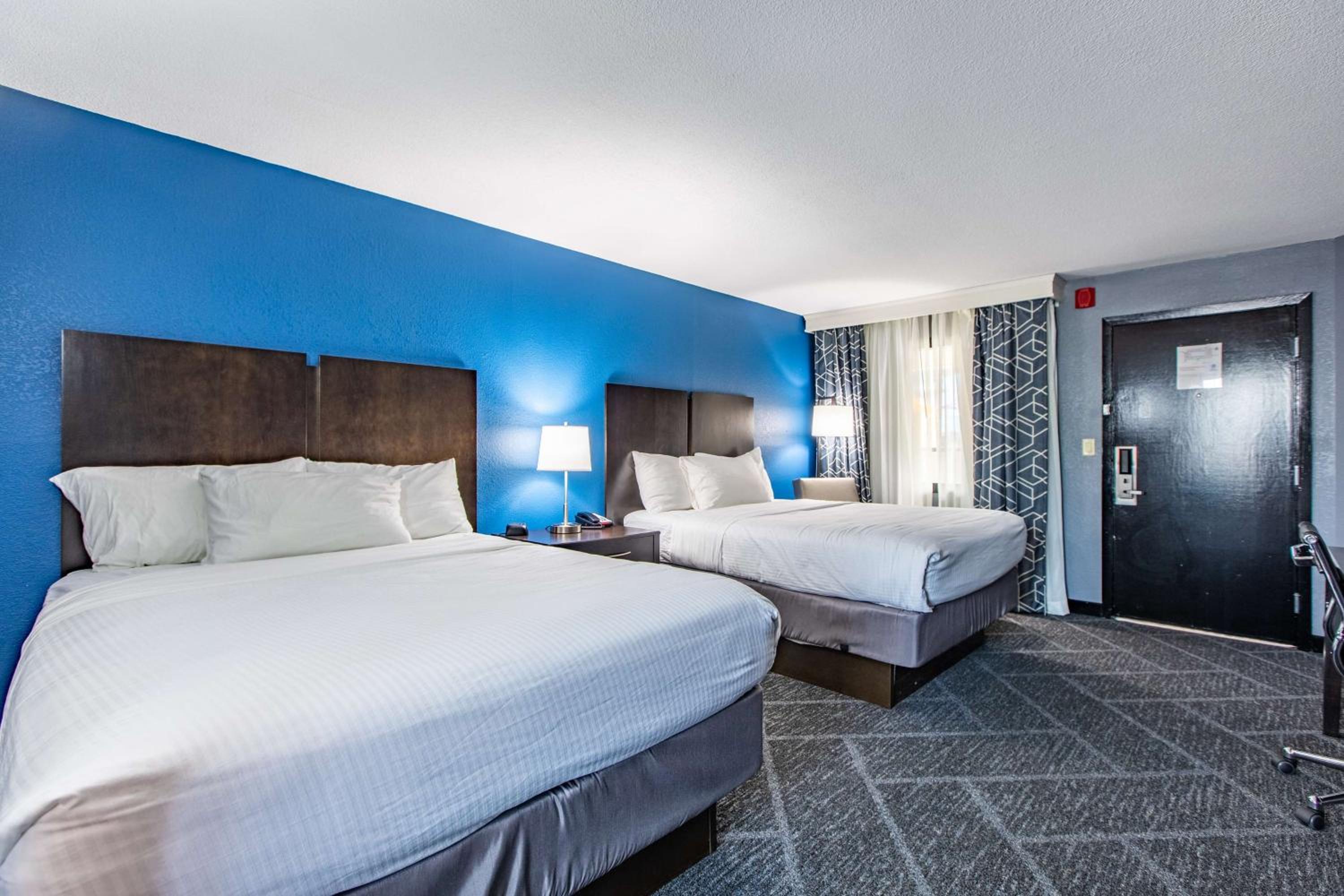 Queen Room with Two Queen Beds and Word Desk - Pool View - Photo 1