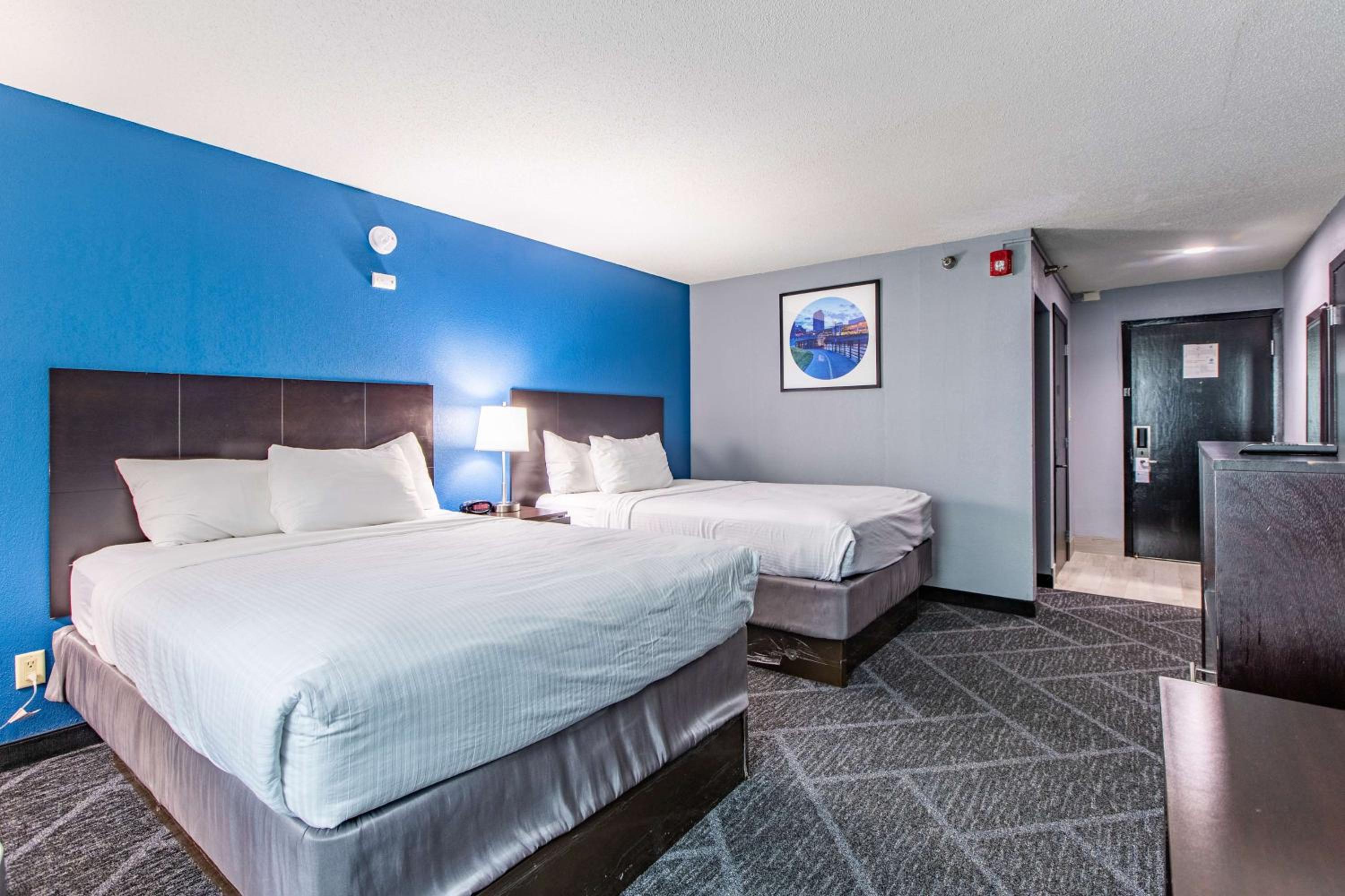 Queen Room with Two Queen Beds and Work Desk - Photo 1