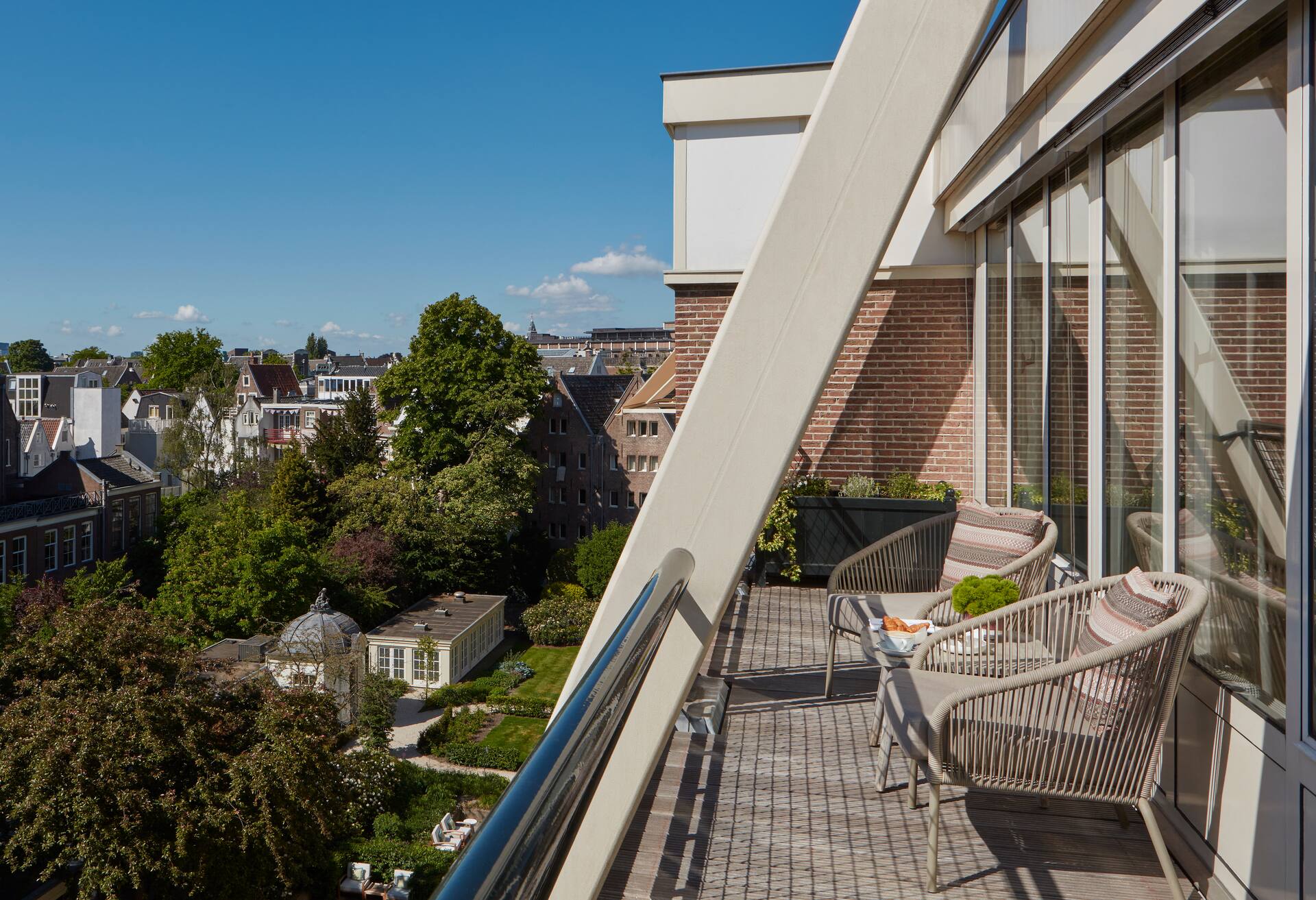Junior Suite with Balcony- City Garden Views