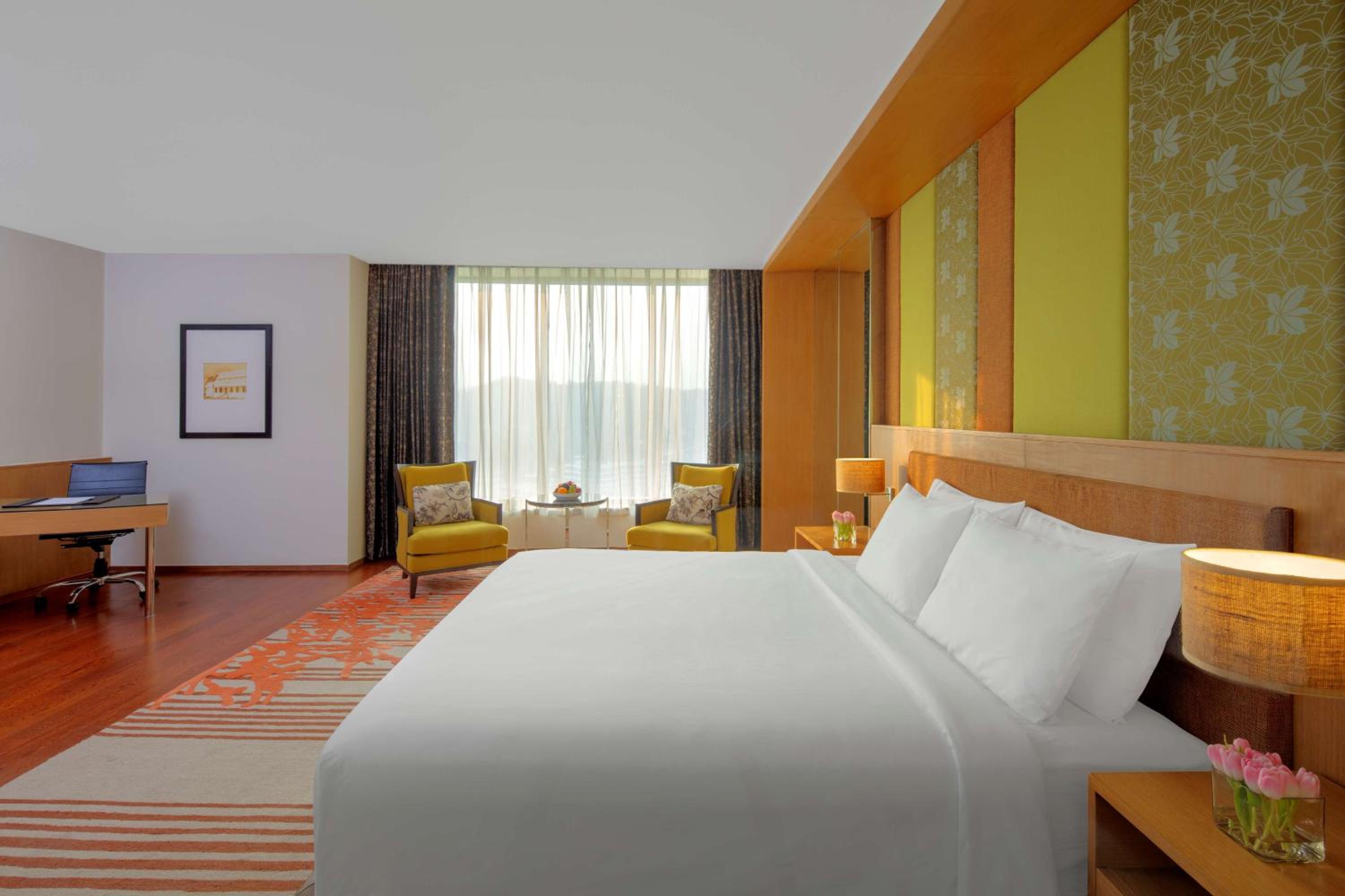 Junior Suite with King Bed with Bath tub , Lake View , Lounge Access ,Complimentary One Way Airport Transfer, 2 Pcs Complimentary Laundry , 15% off on Food & Soft Beverages and Pick up and drop from Kamakhya Temple   photo 2