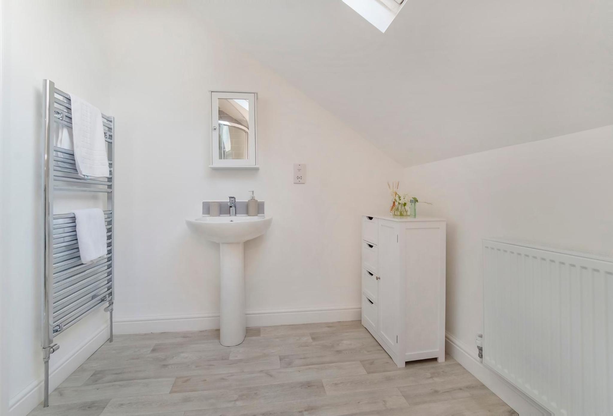 Three-Bedroom House - Photo 25