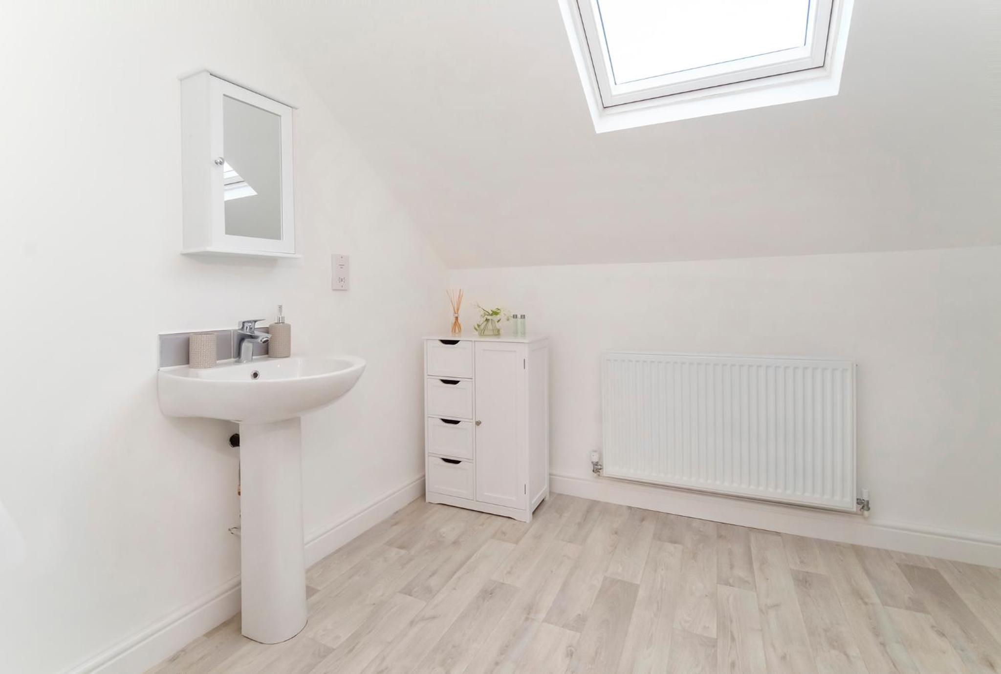 Three-Bedroom House - Photo 27