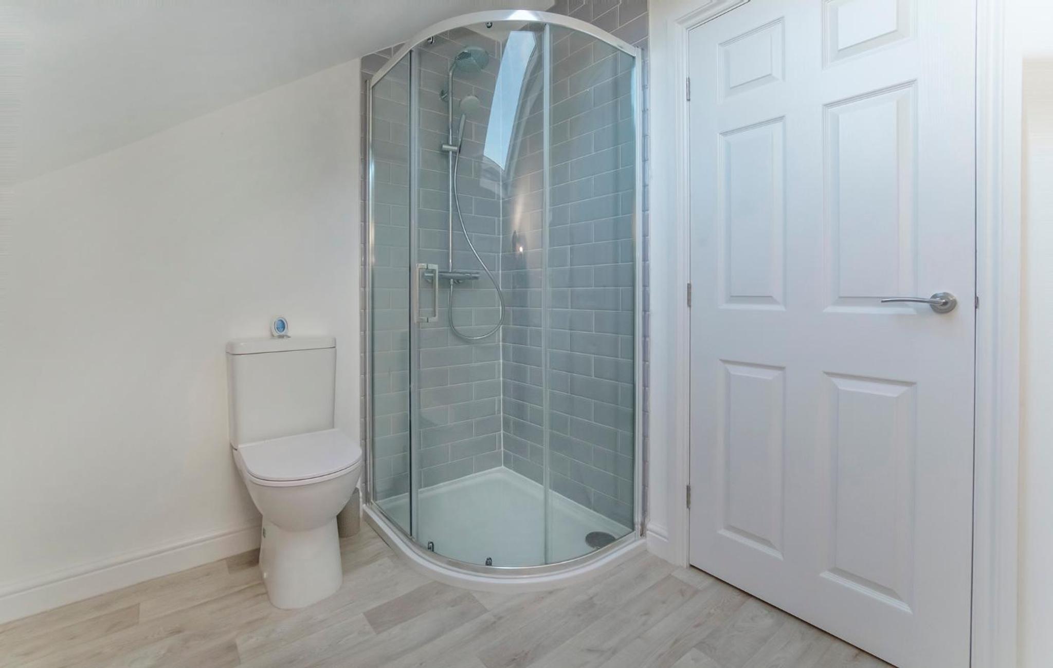 Three-Bedroom House - Photo 28