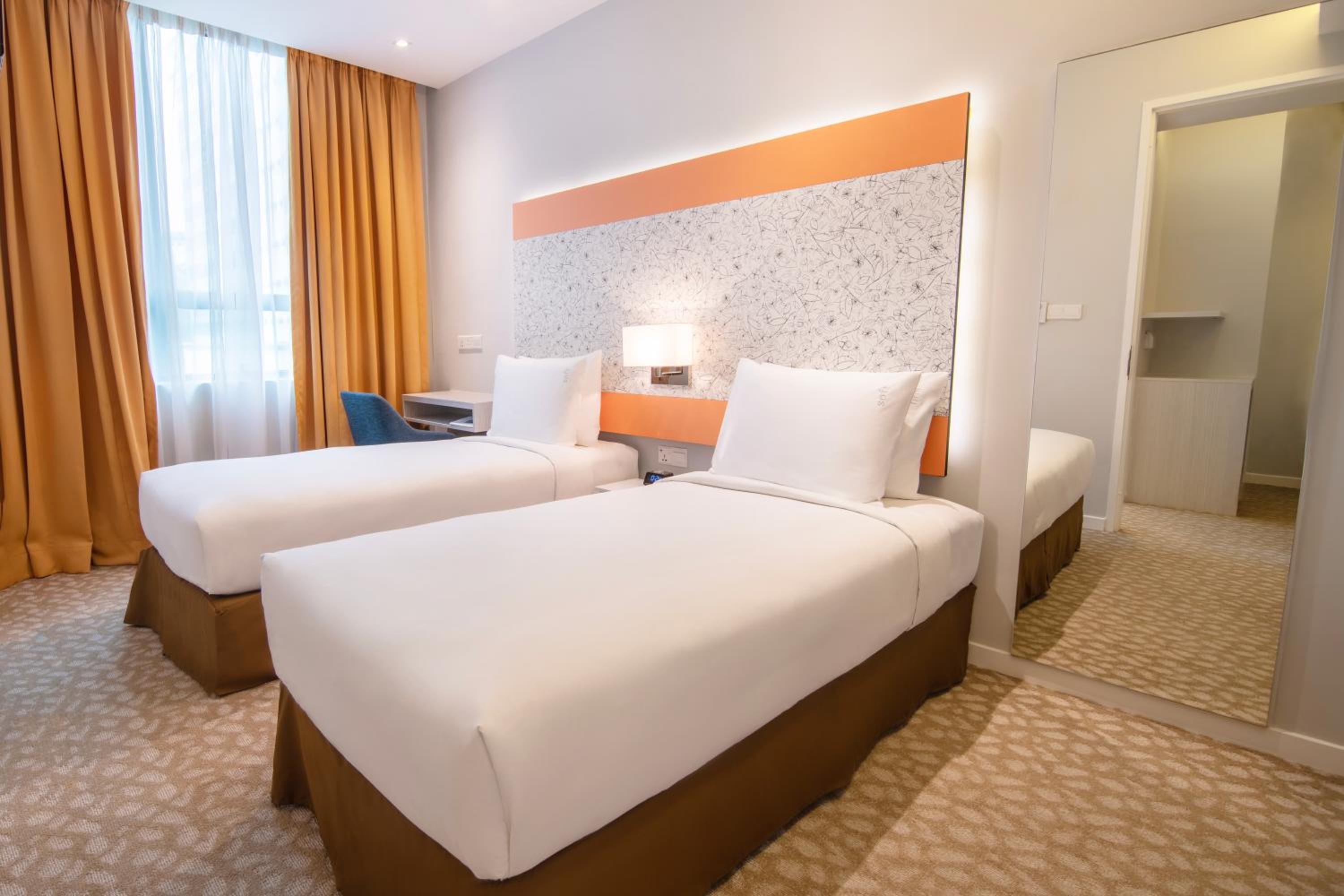 Two-Bedroom Suite with One Queen and Two Single Beds