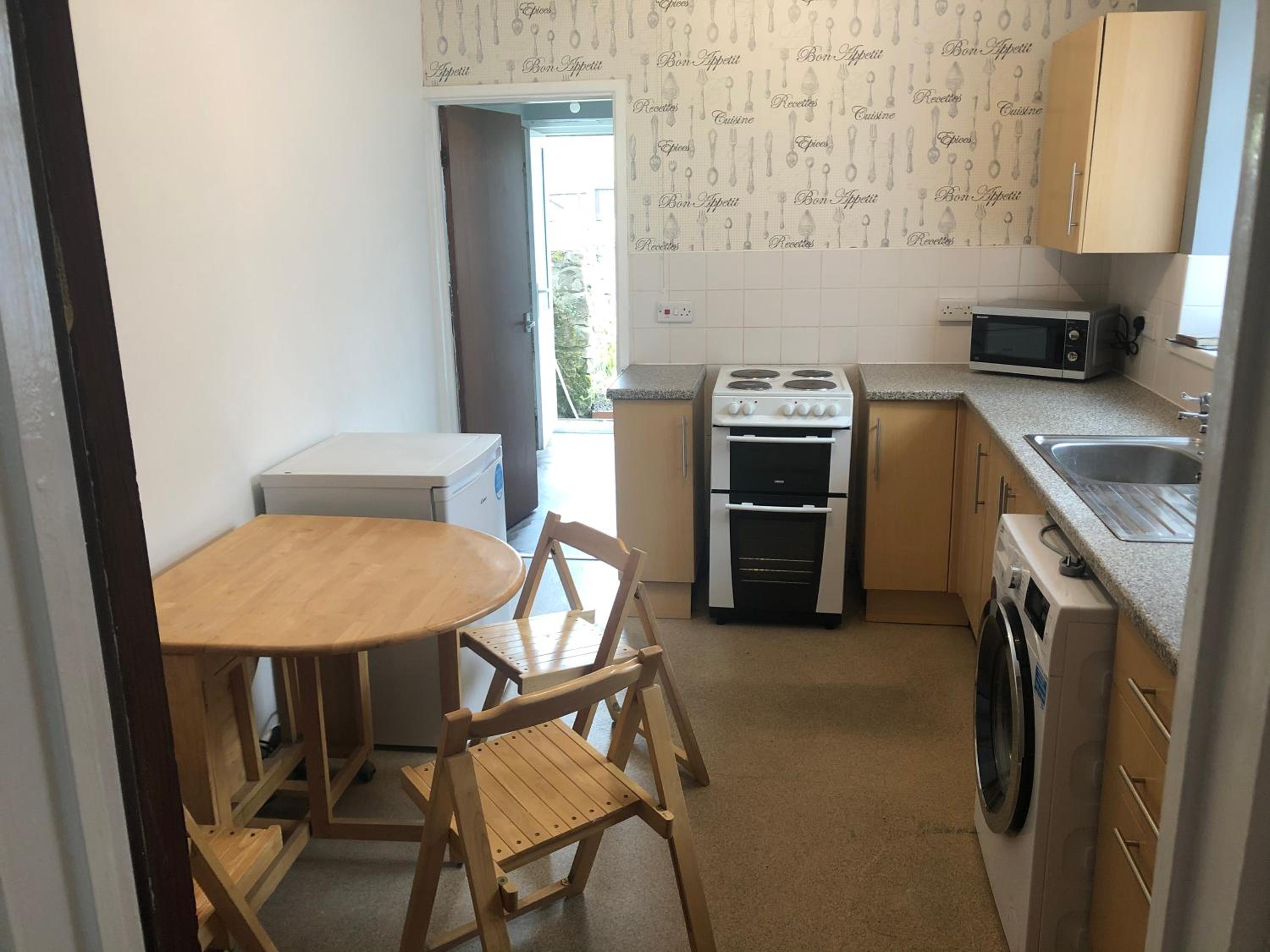 Three-Bedroom House - Photo 18