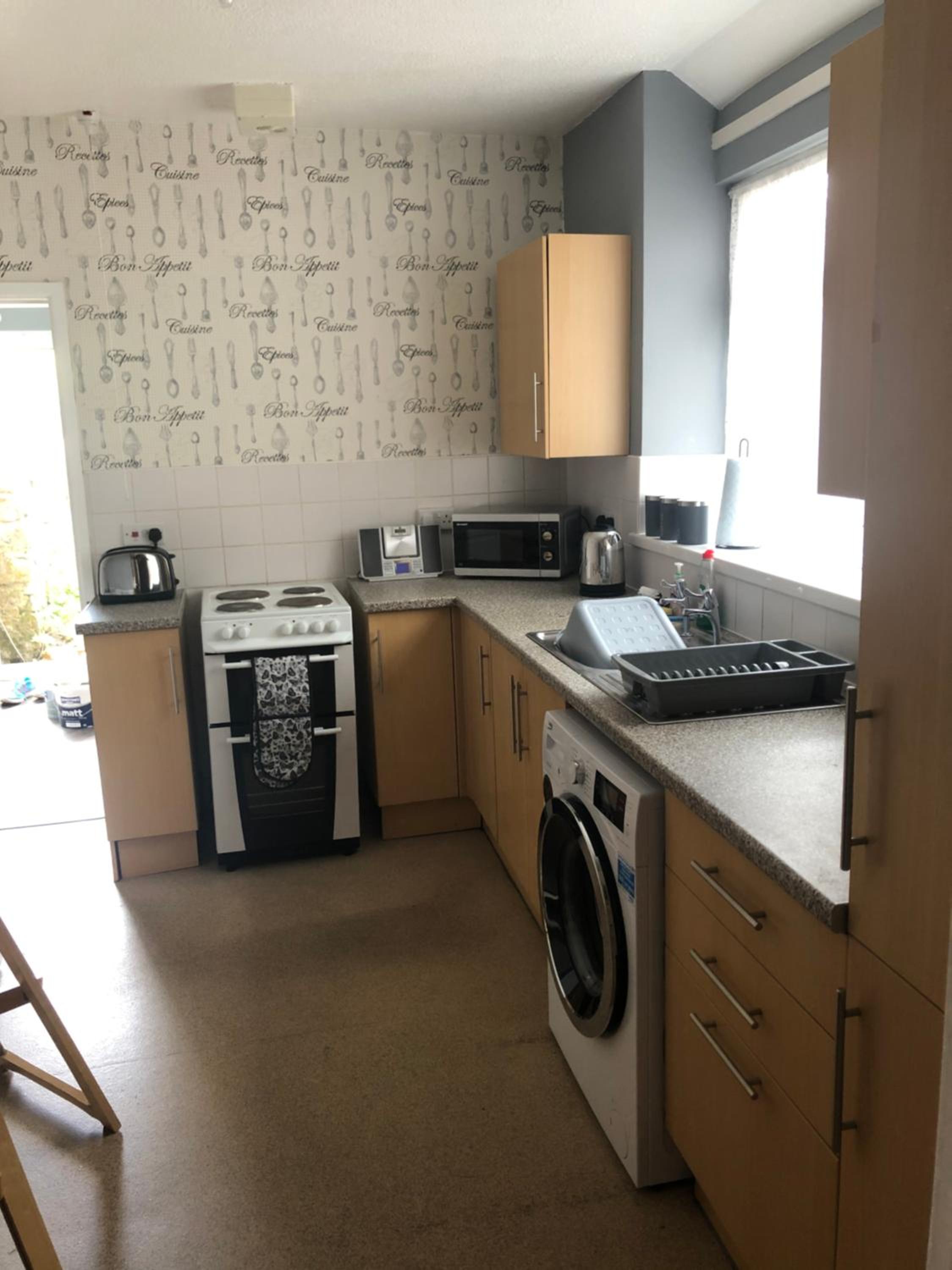 Three-Bedroom House - Photo 16