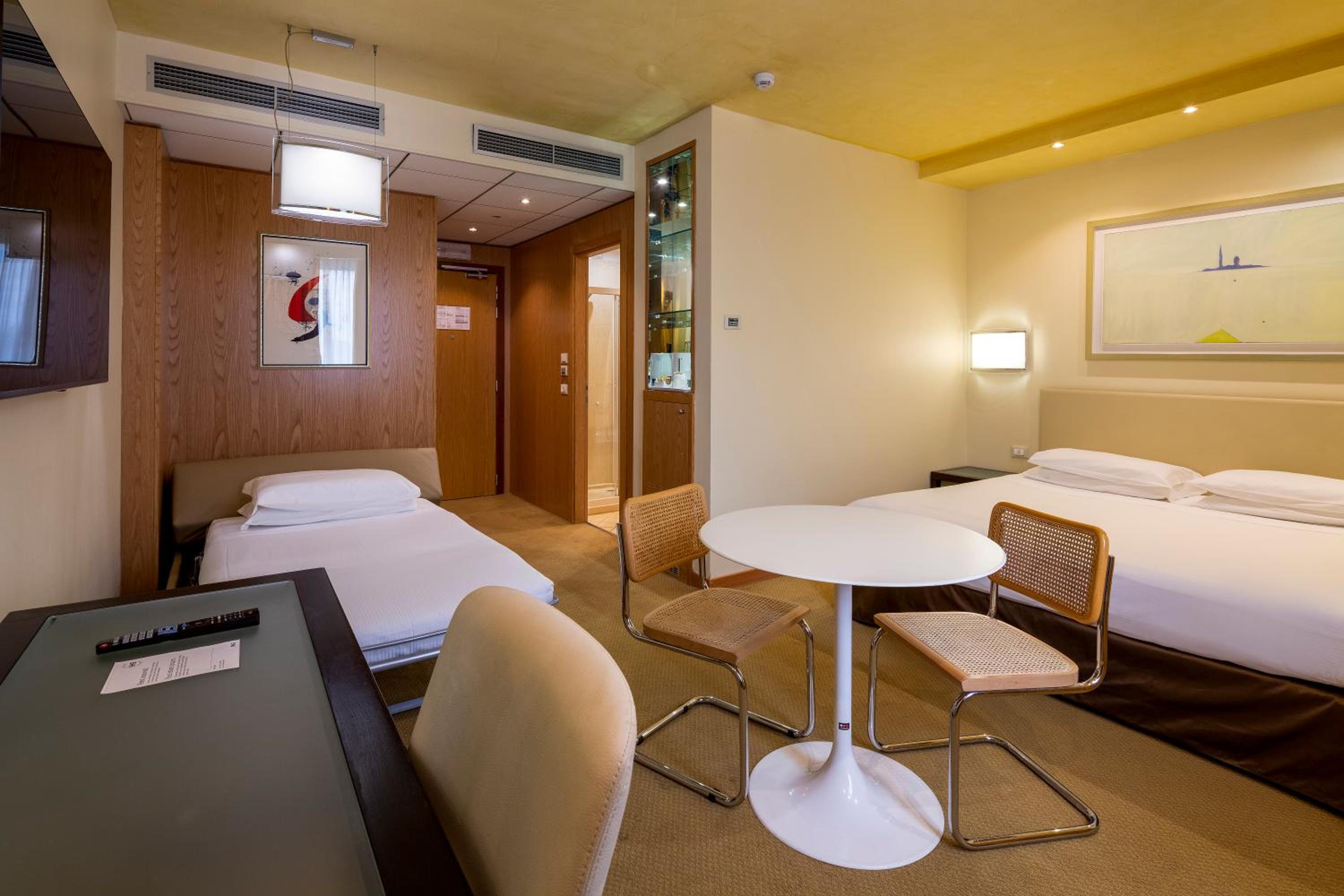 Premium King Room with Sofa Bed - Photo 1