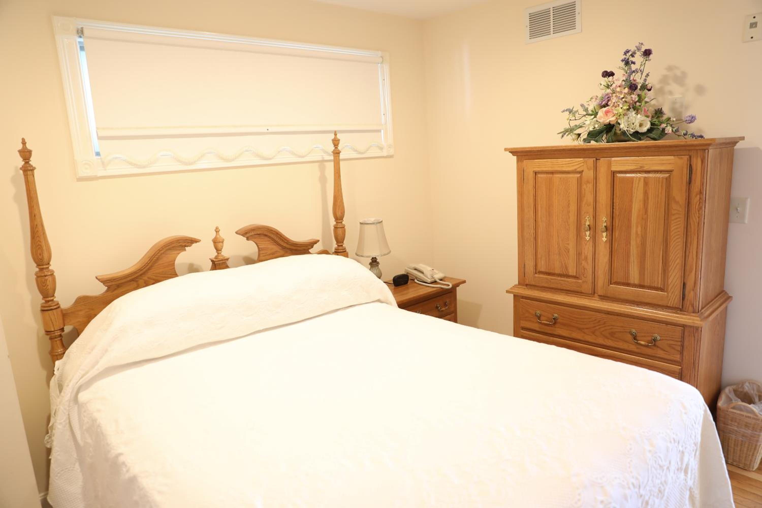 One-Bedroom Suite with Kitchen, Deck, and Partial Ocean View – 1A