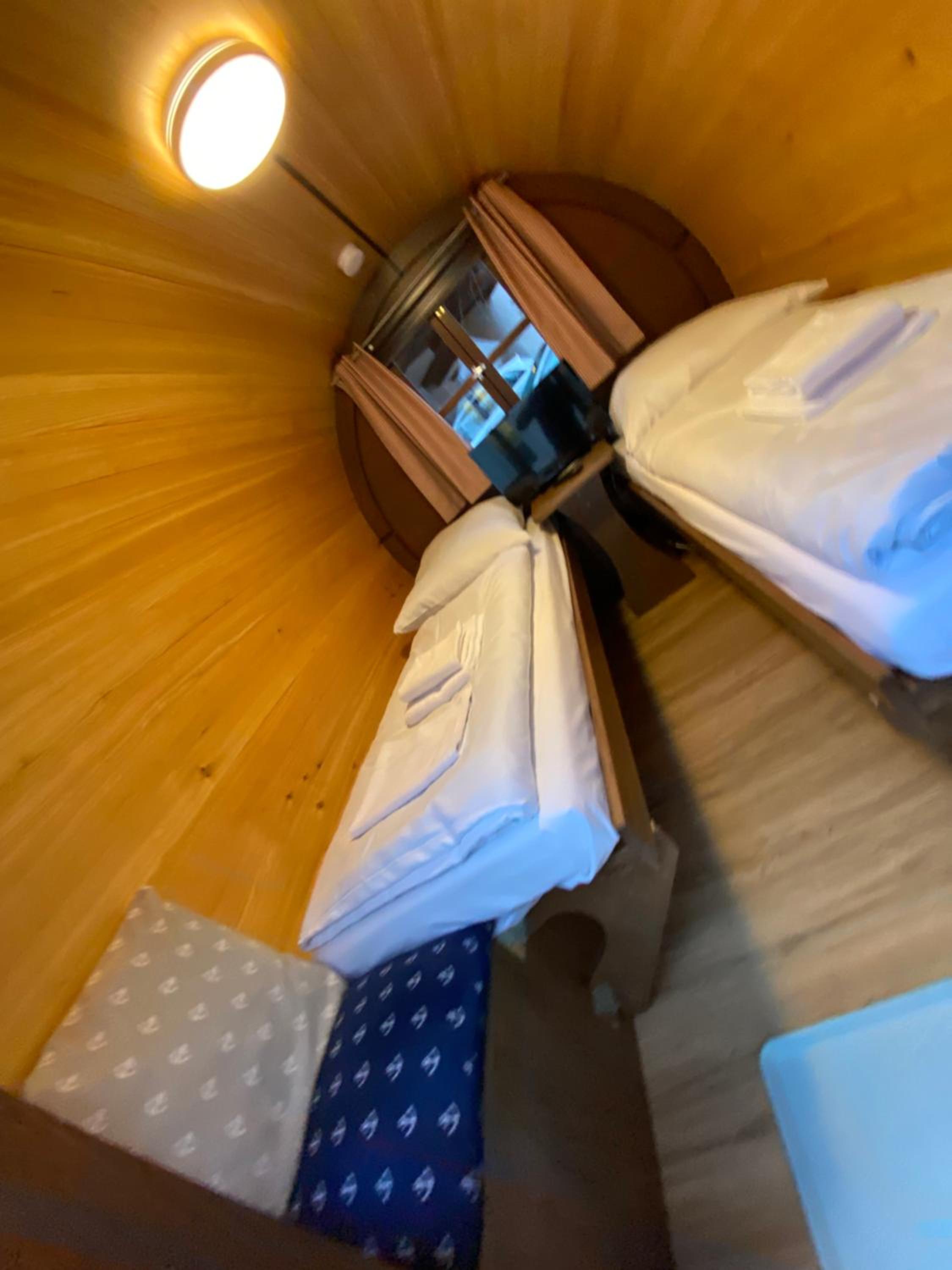 Wine barrel with shared bathroom