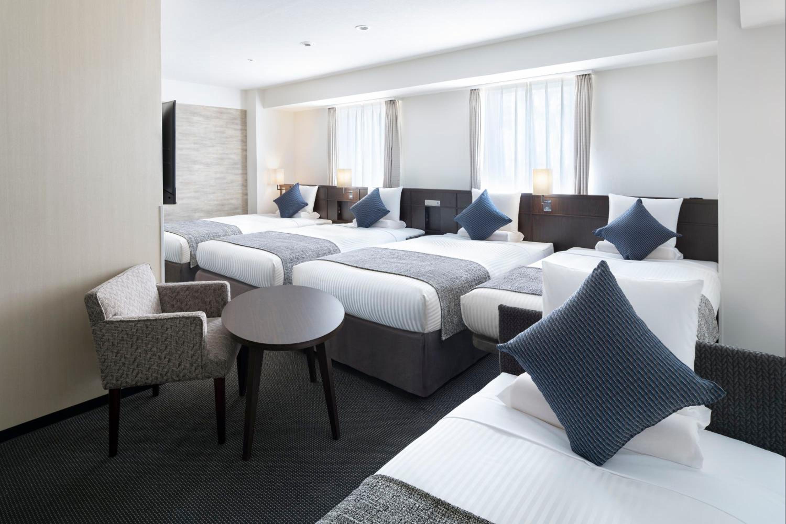 House Keeping is Optional with Additional Cost - Deluxe Quadruple Room  with Extra Bed - Non-Smoking photo 1