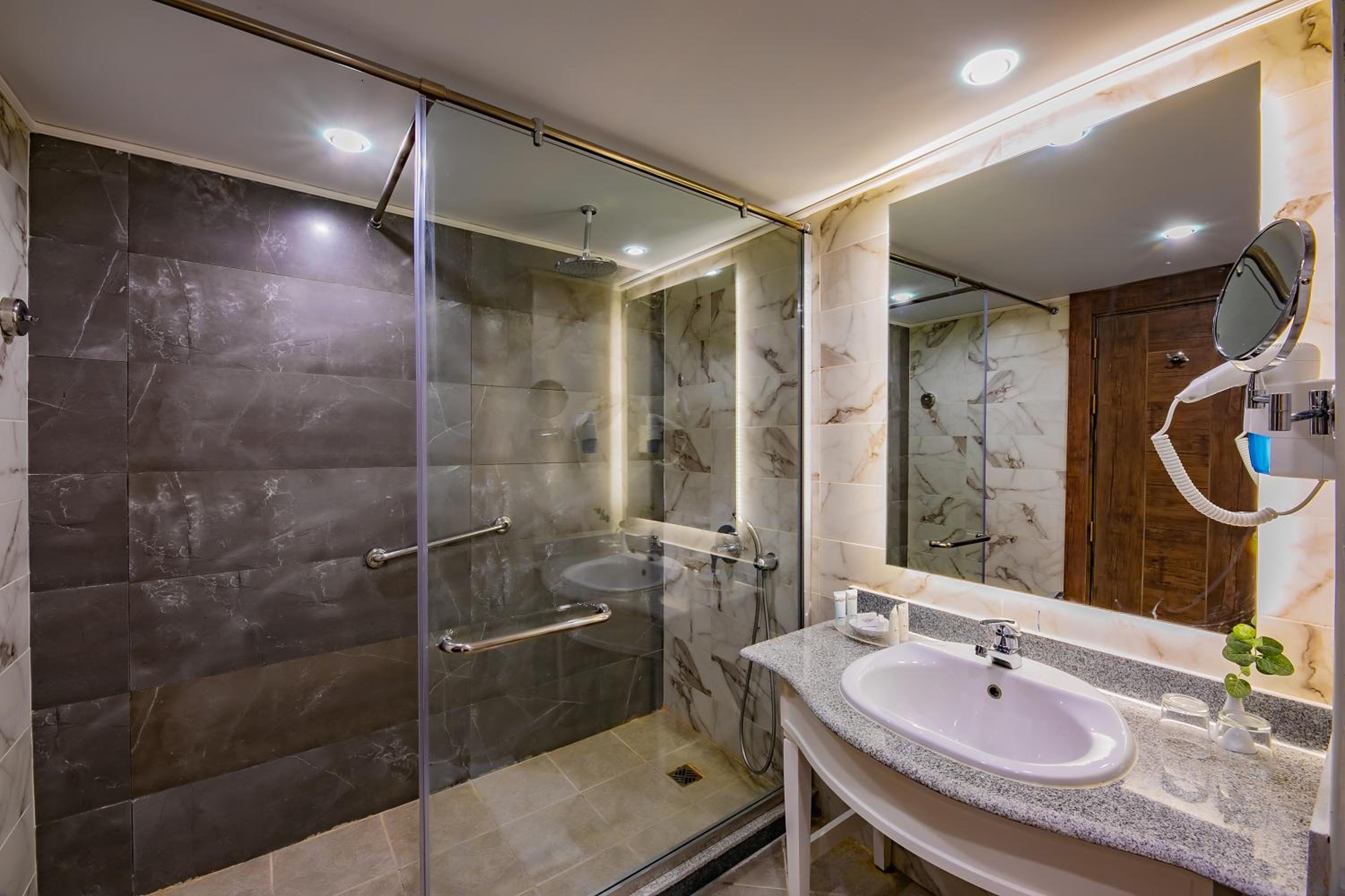 Relax in our luxurious, modern bathroom oasis.