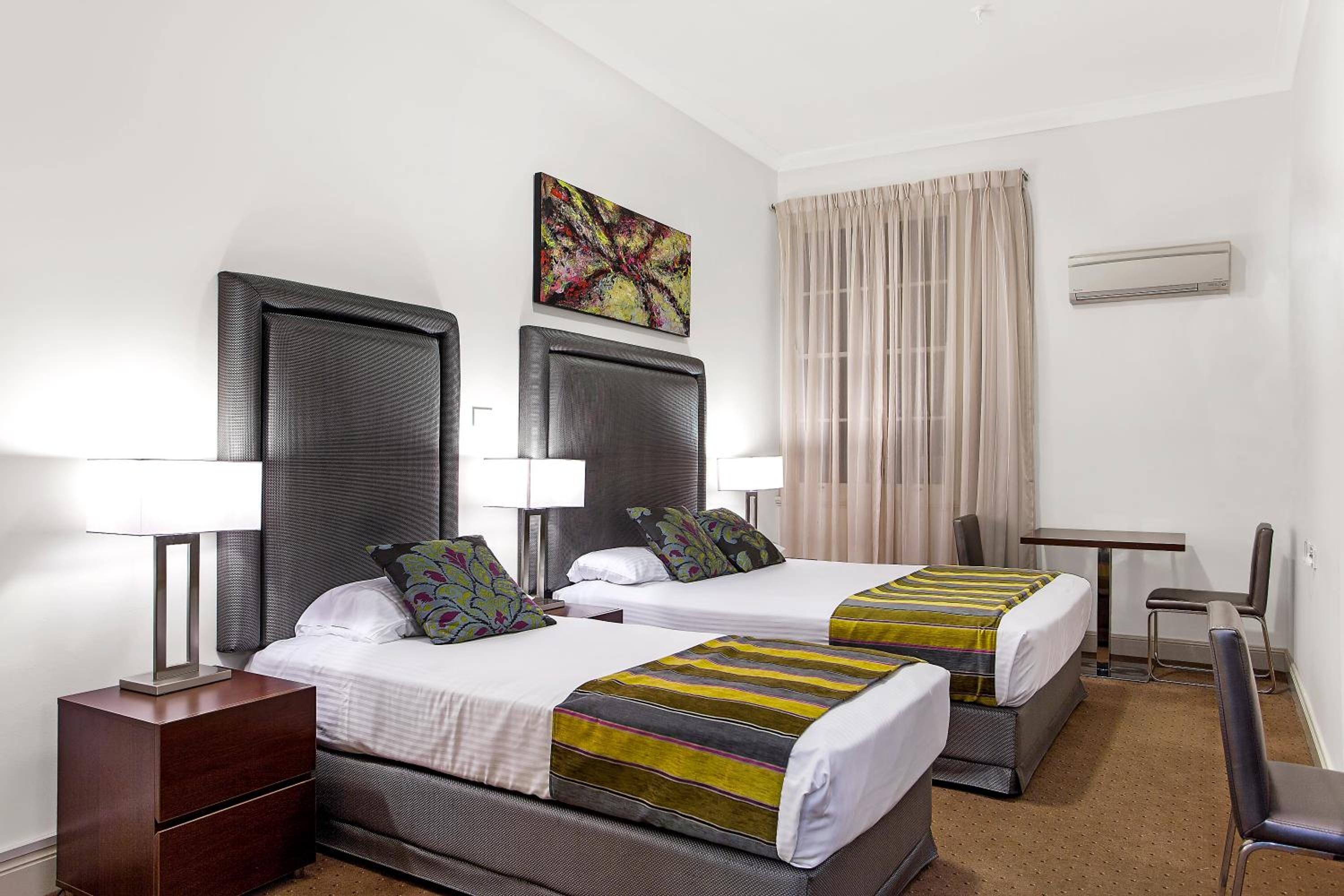 Standard Room with One Queen Bed and One Single Bed