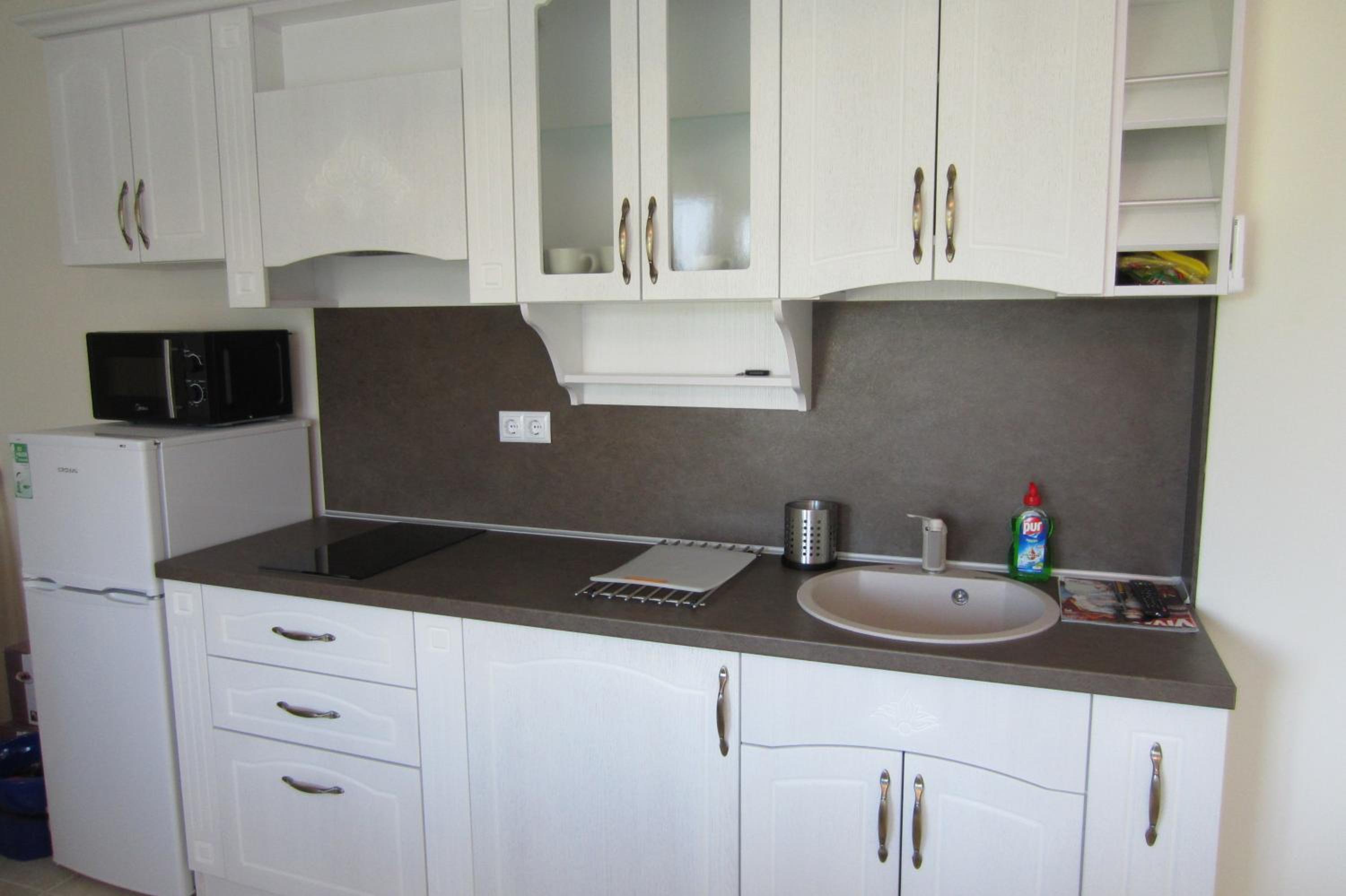 One-Bedroom Apartment with Balcony and Town View photo 3