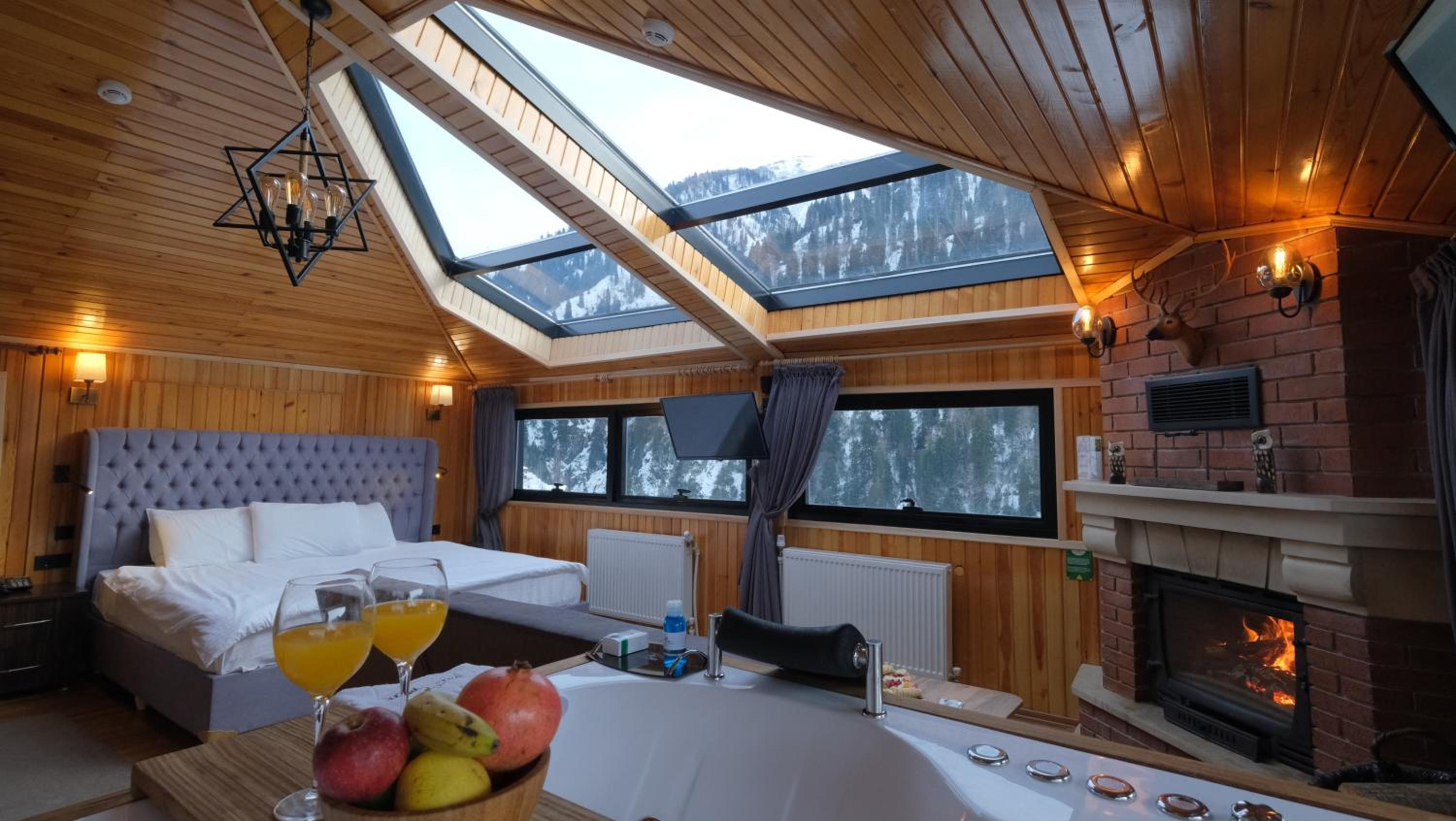 Junior Suite with Fire Place and Hot Tub - Waterfall View