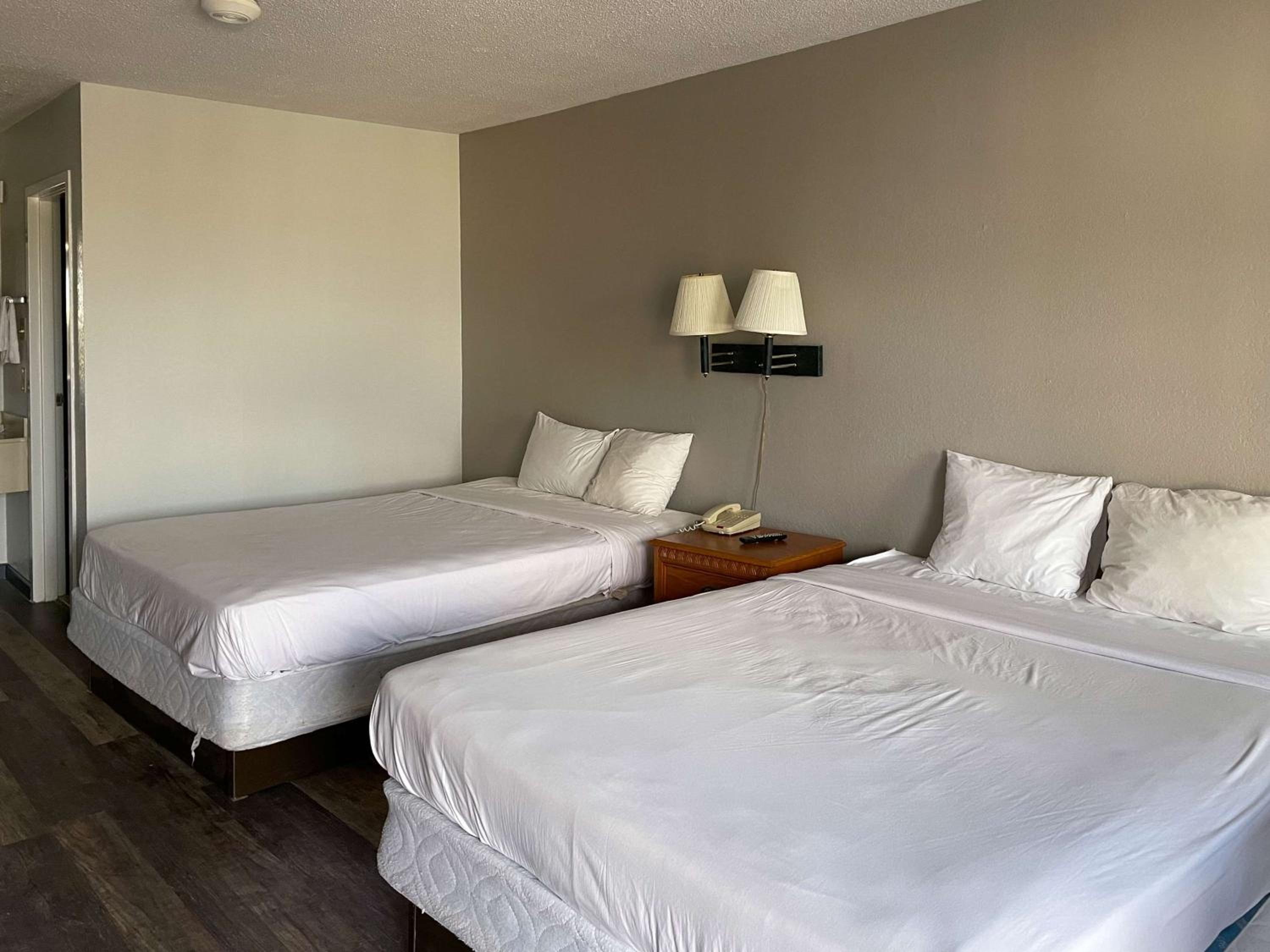 Queen Room with Two Queen Beds - Smoking - Photo 1