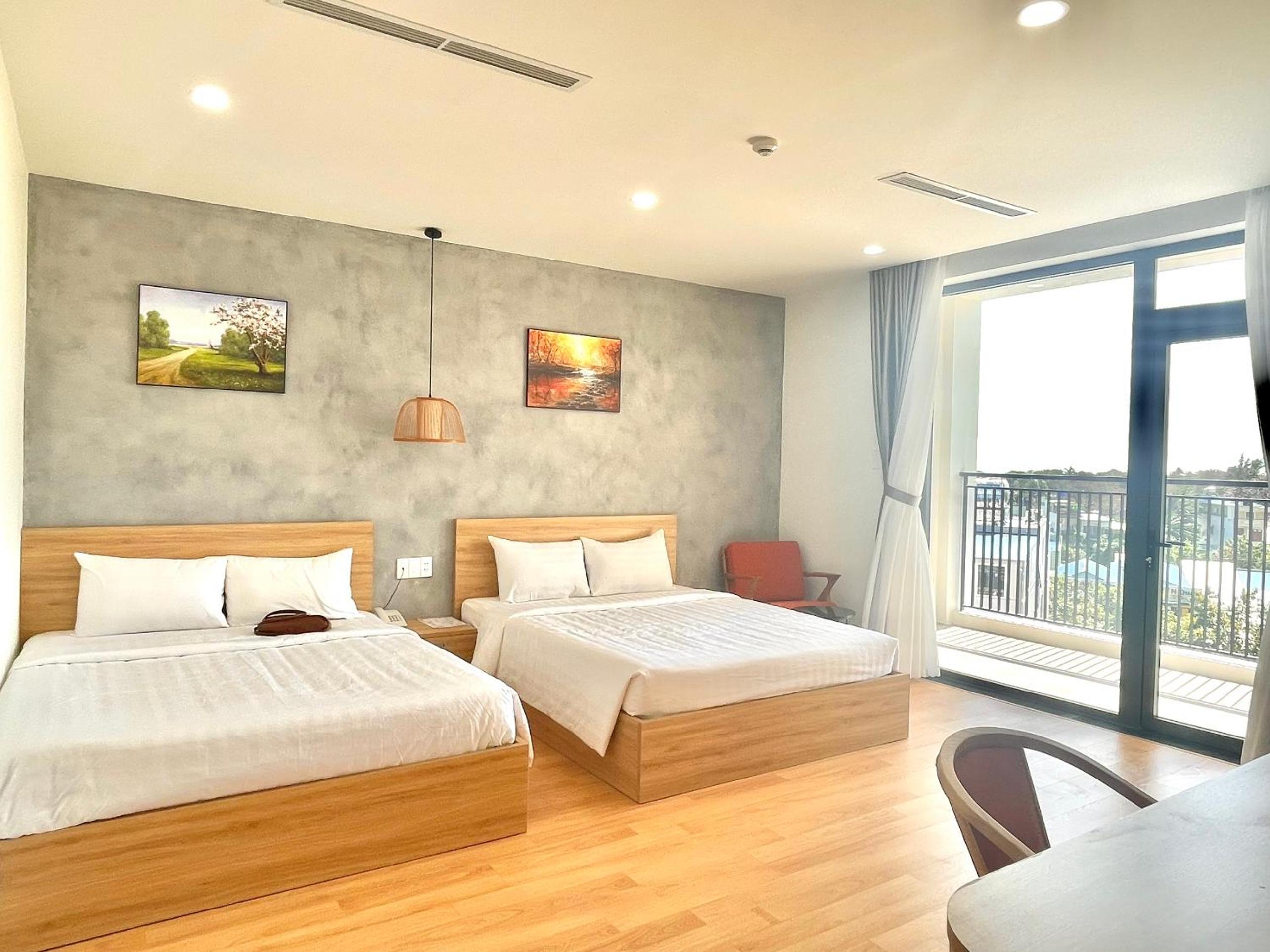 Deluxe Quadruple Room - Photo 2