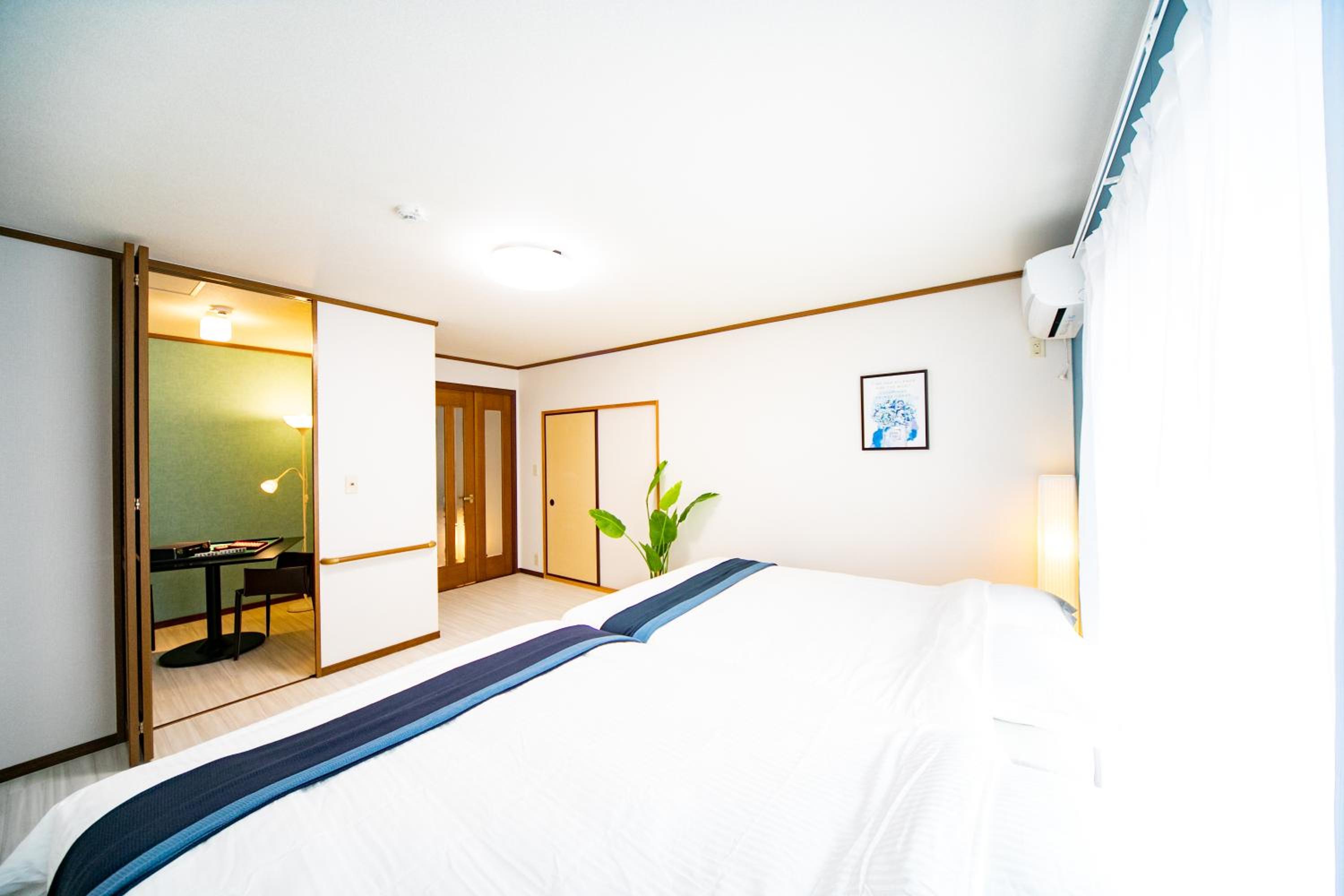 Three-Bedroom House - Photo 25