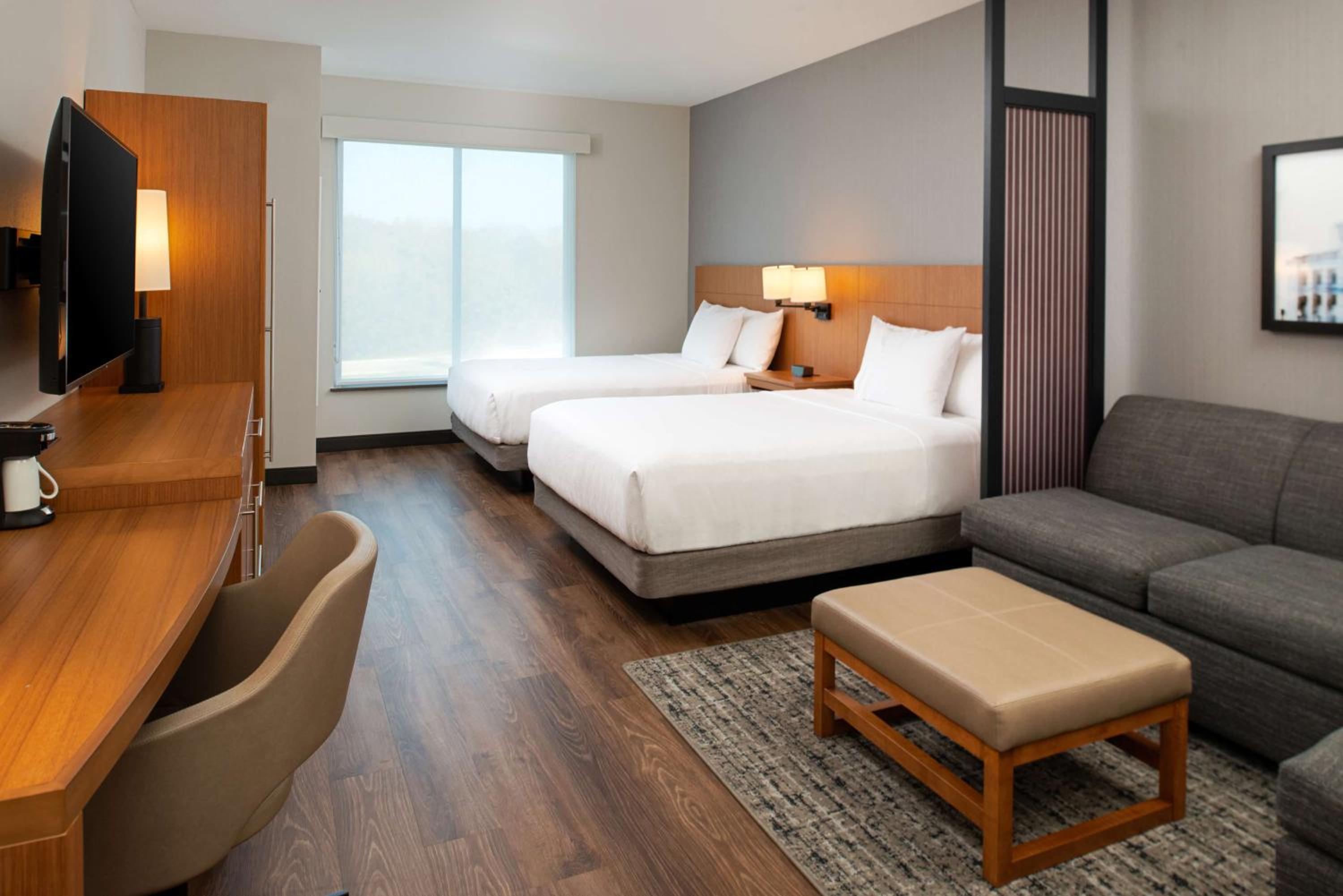 Standard Queen Room with Two Queen Beds and Sofa Bed - Photo 1