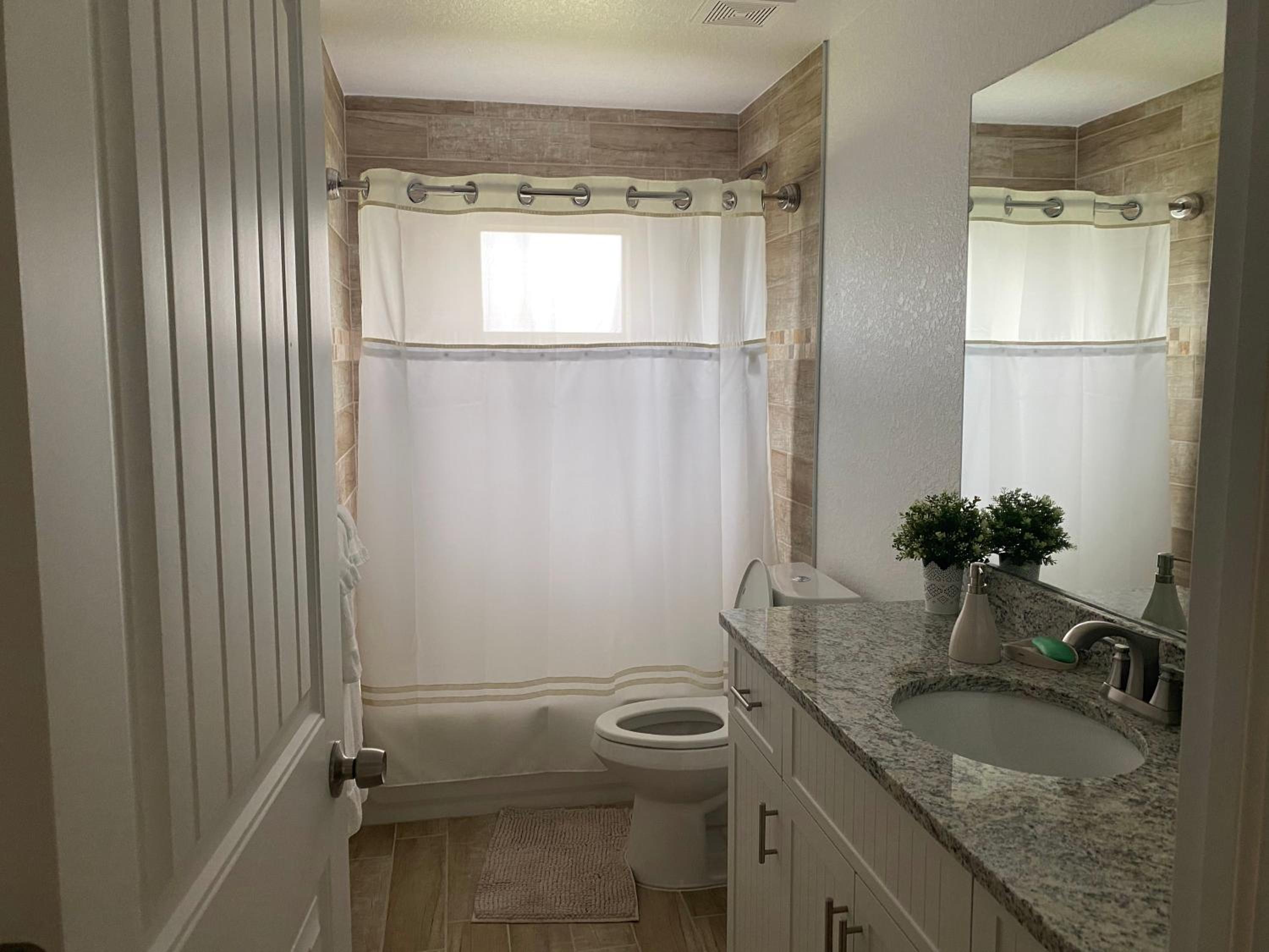 Three-Bedroom House - Photo 25