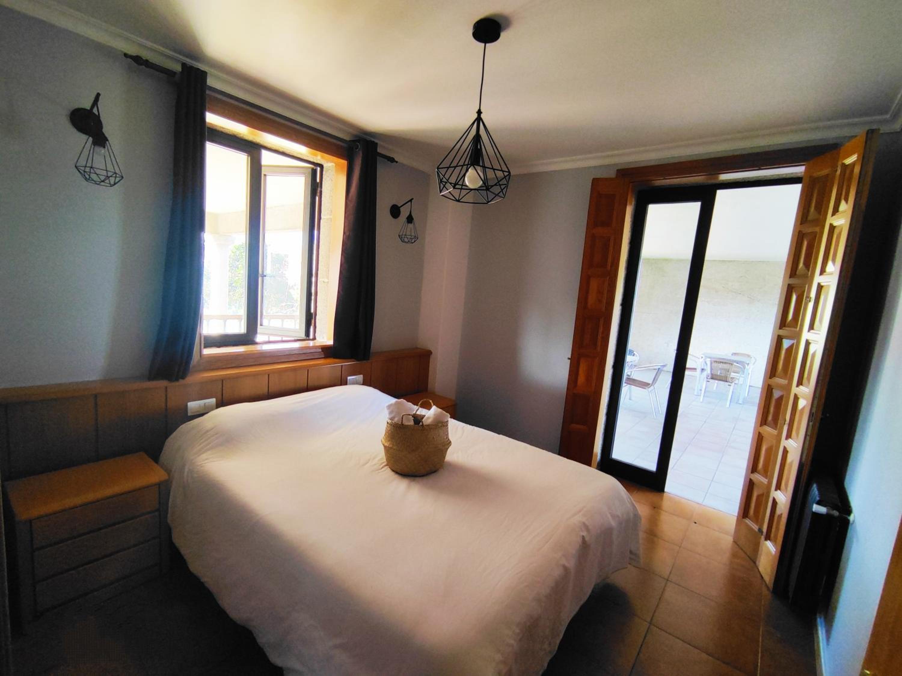 Habitación Queen con Baño Compartido