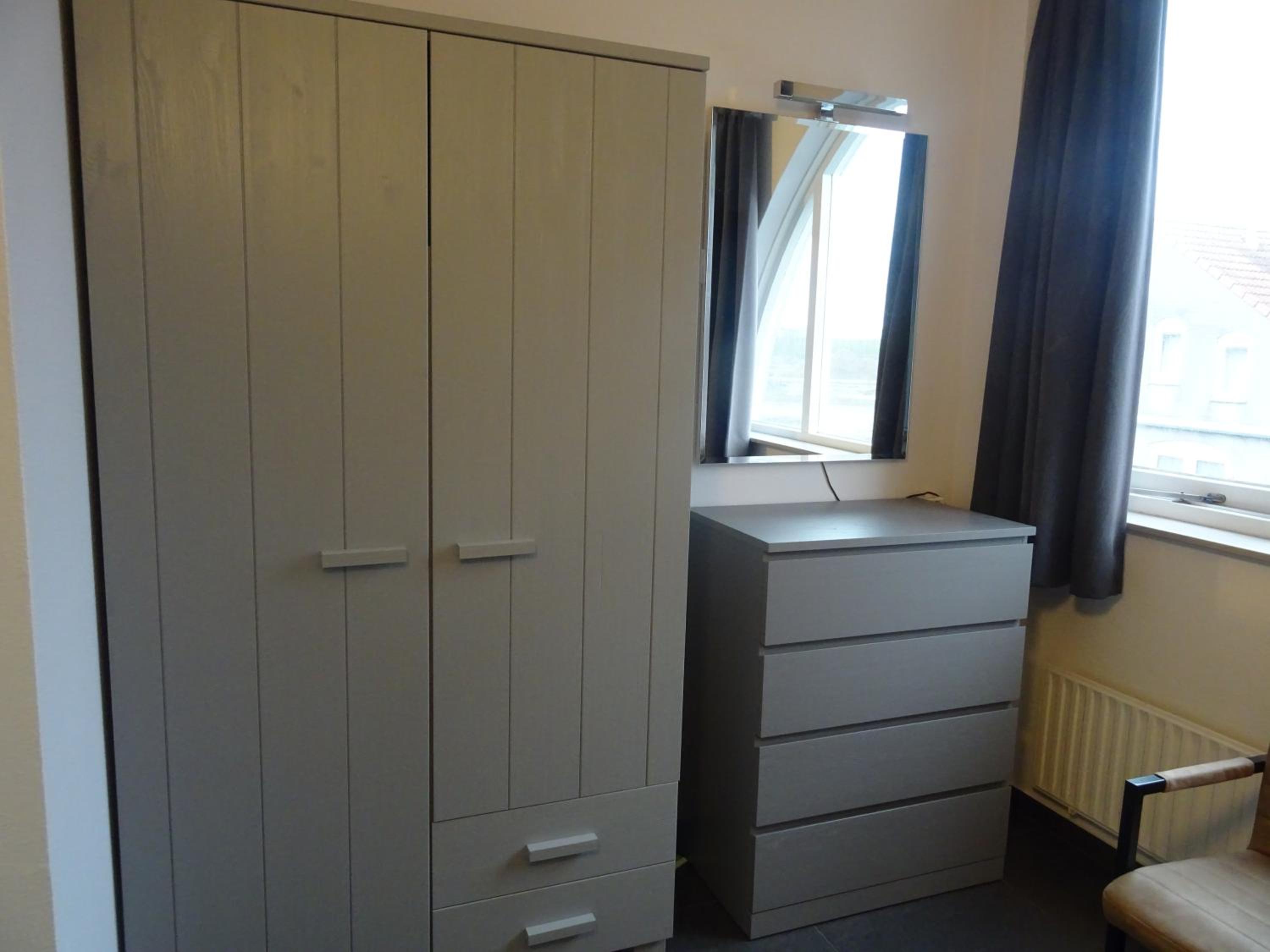 Three-Bedroom House - Photo 18