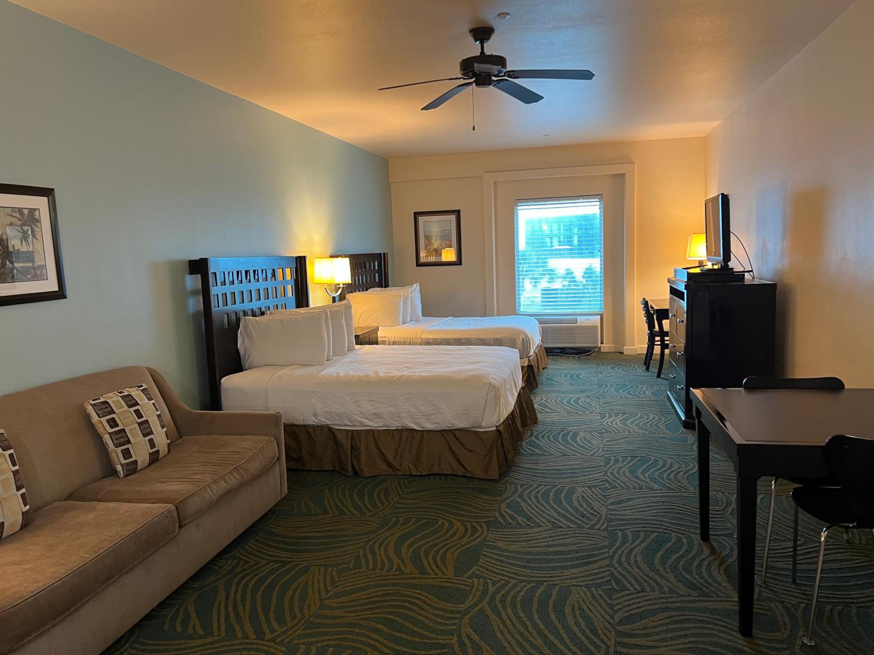 Queen Suite with Two Queen Beds and Sofa Bed - Photo 1