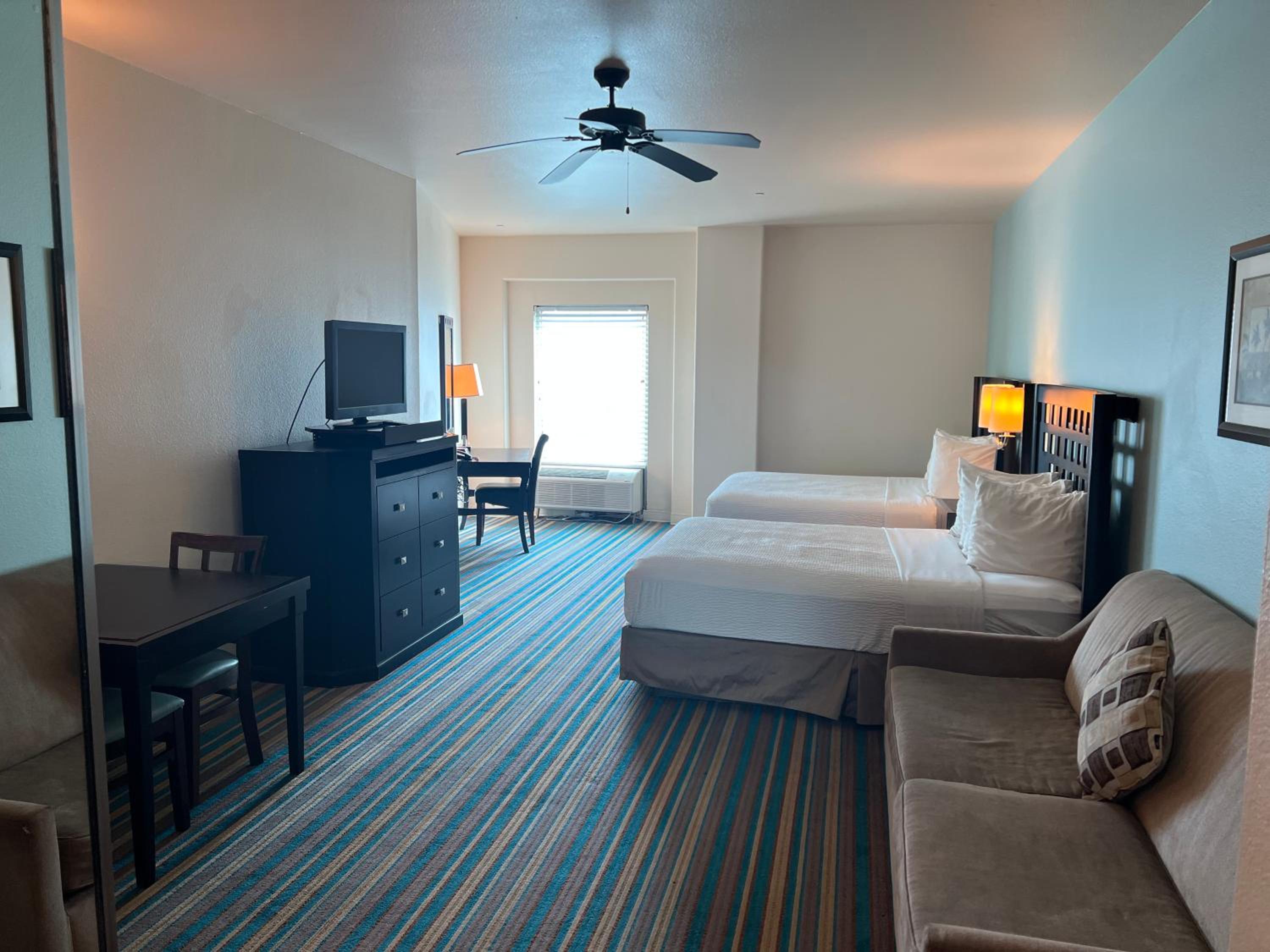 Queen Suite with Two Queen Beds and Sofa Bed - Photo 9