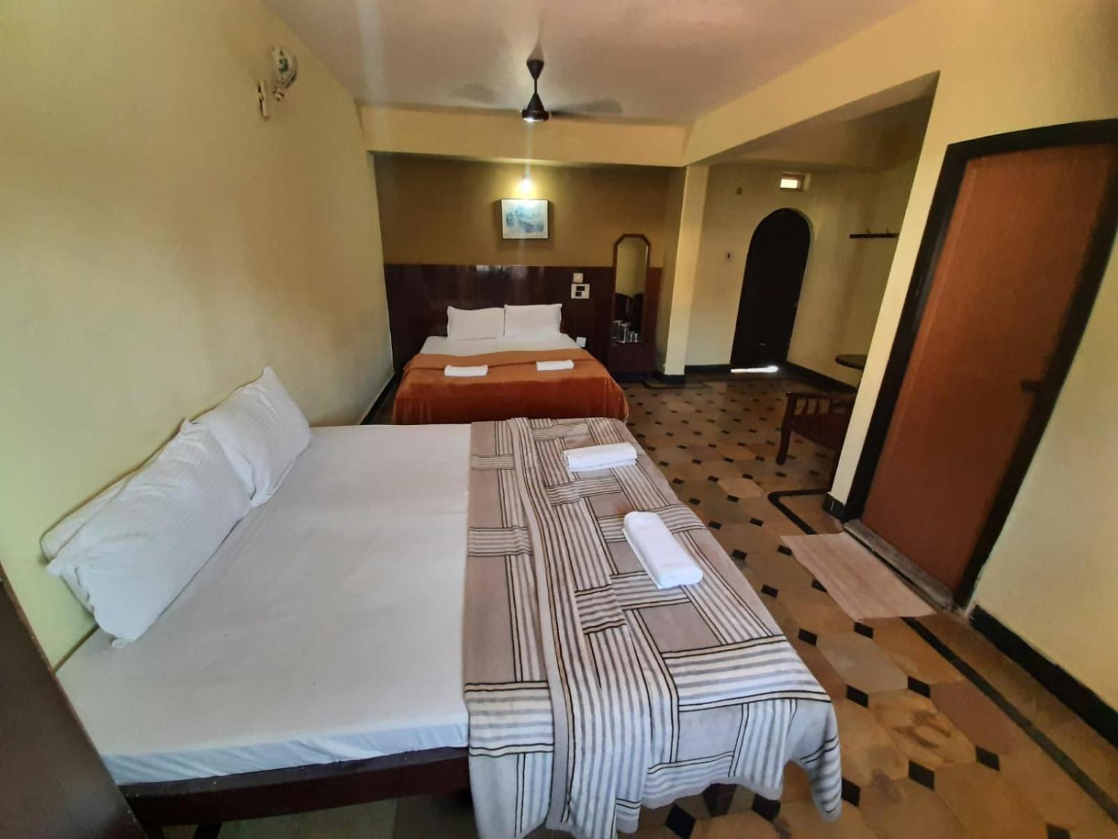 Deluxe Queen Room With Two Queen Beds photo 1