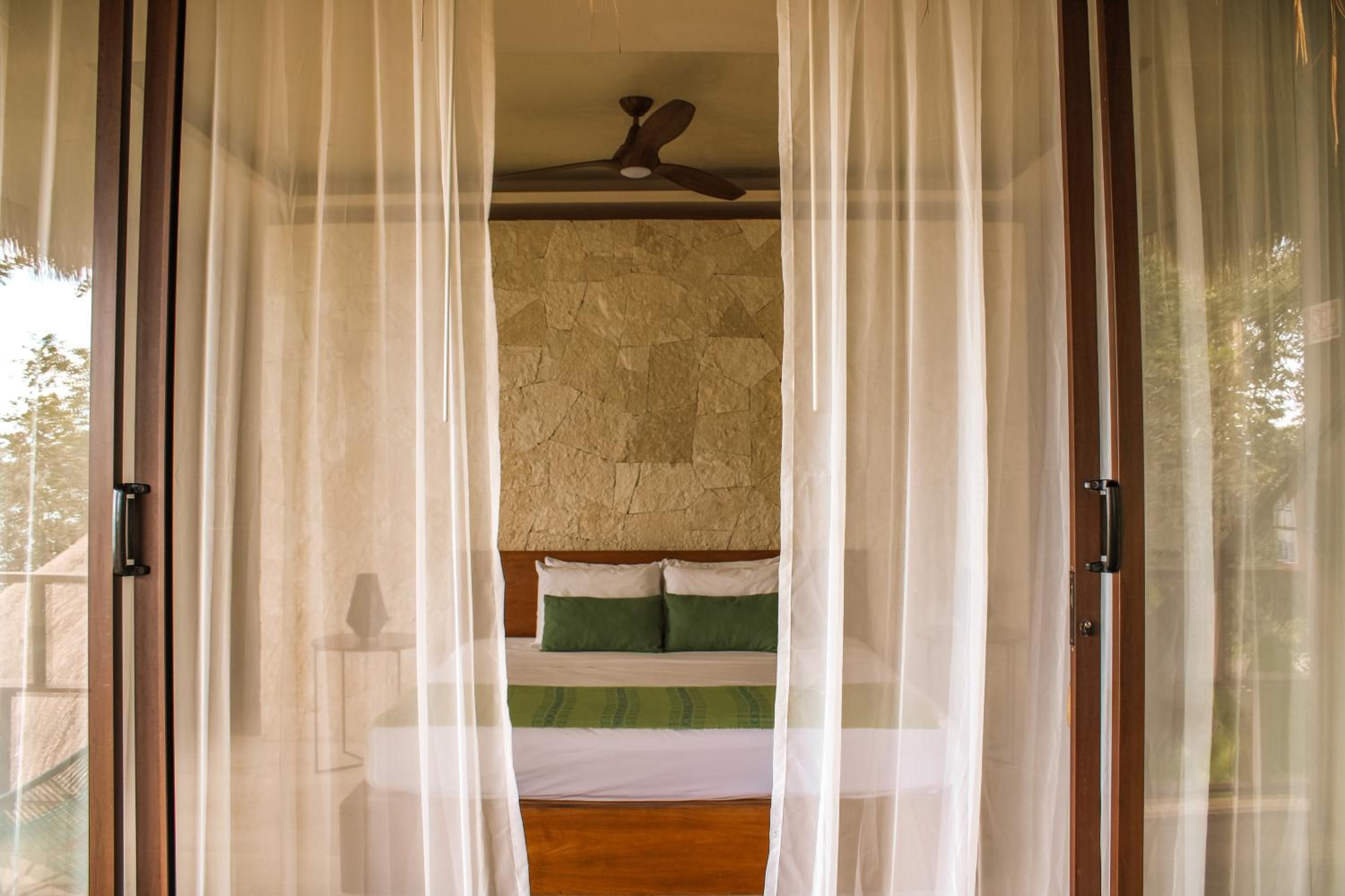 Deluxe King with Balcony Garden View - Photo 1