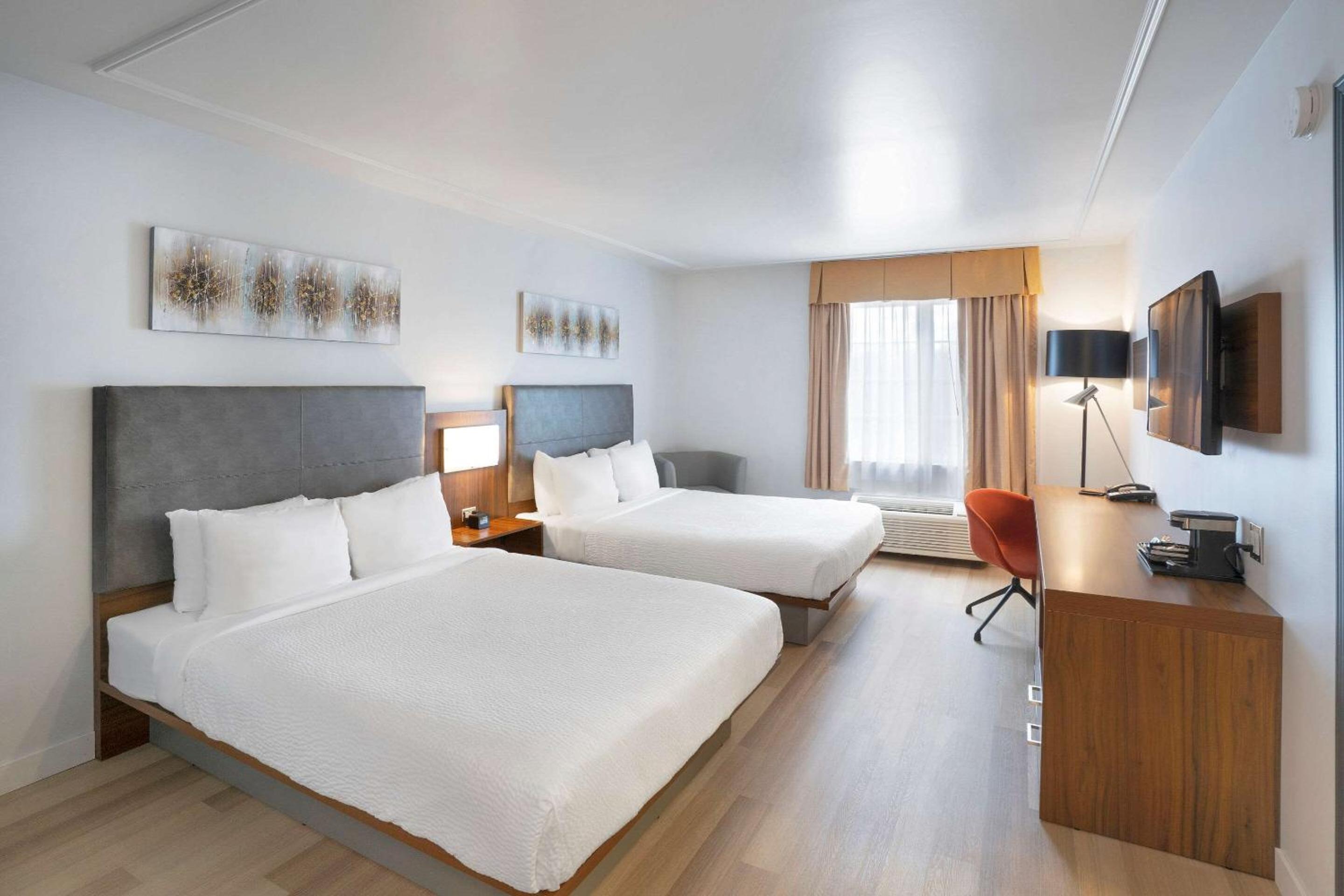 Standard Queen Room with Two Queen Beds - Non Smoking/No Pets - Photo 1