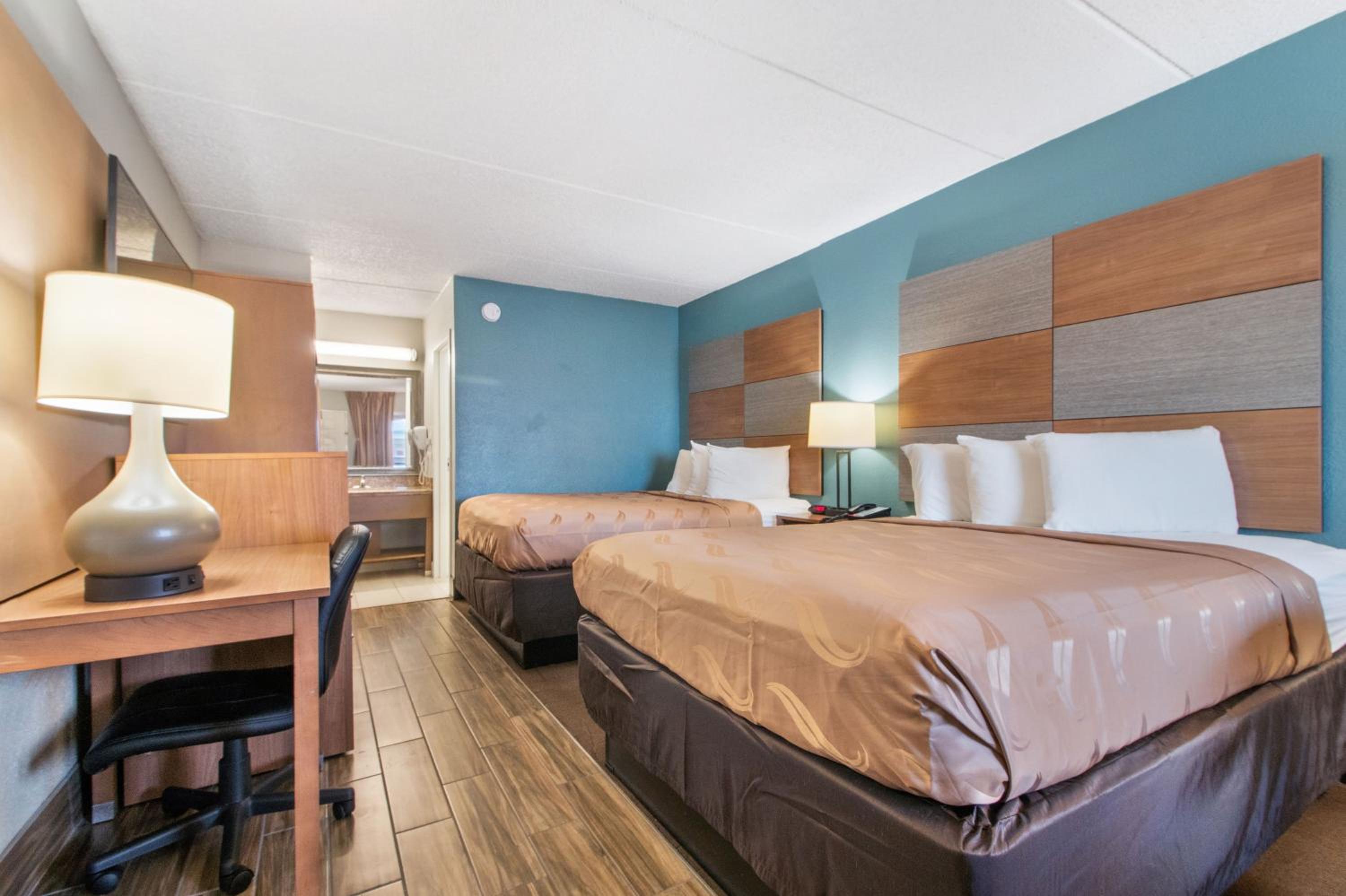 Two Queen Beds With Partial Sea View