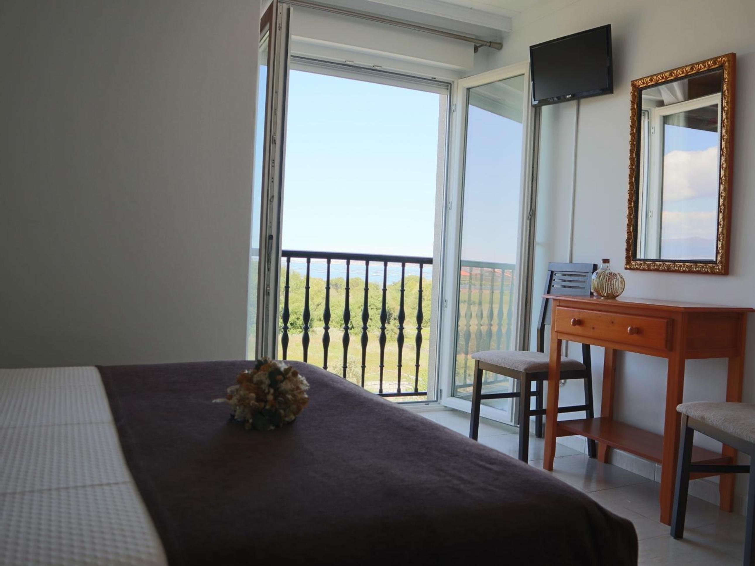 Habitación Doble Deluxe con Balcón y Vista al Mar