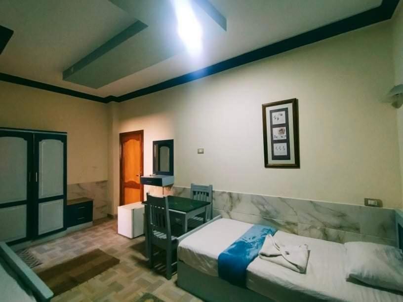 Economy Quadruple Room - Photo 7