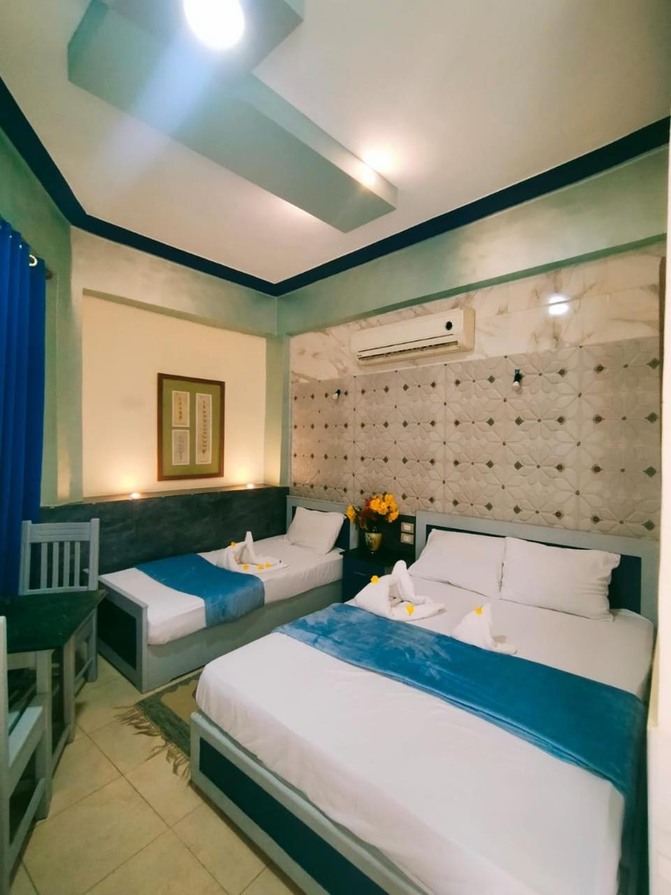 Economy Triple Room - Photo 4