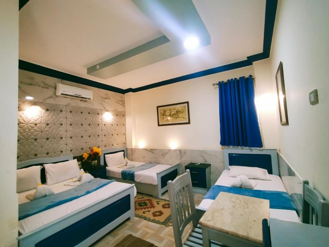 Economy Quadruple Room - Photo 6