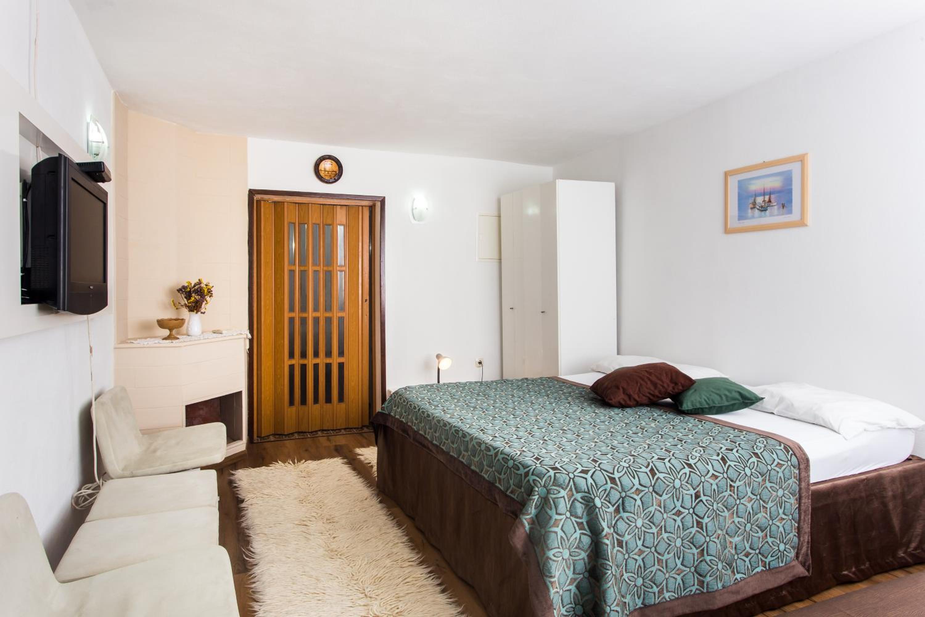 Deluxe One-Bedroom Apartment with Balcony and Garden View