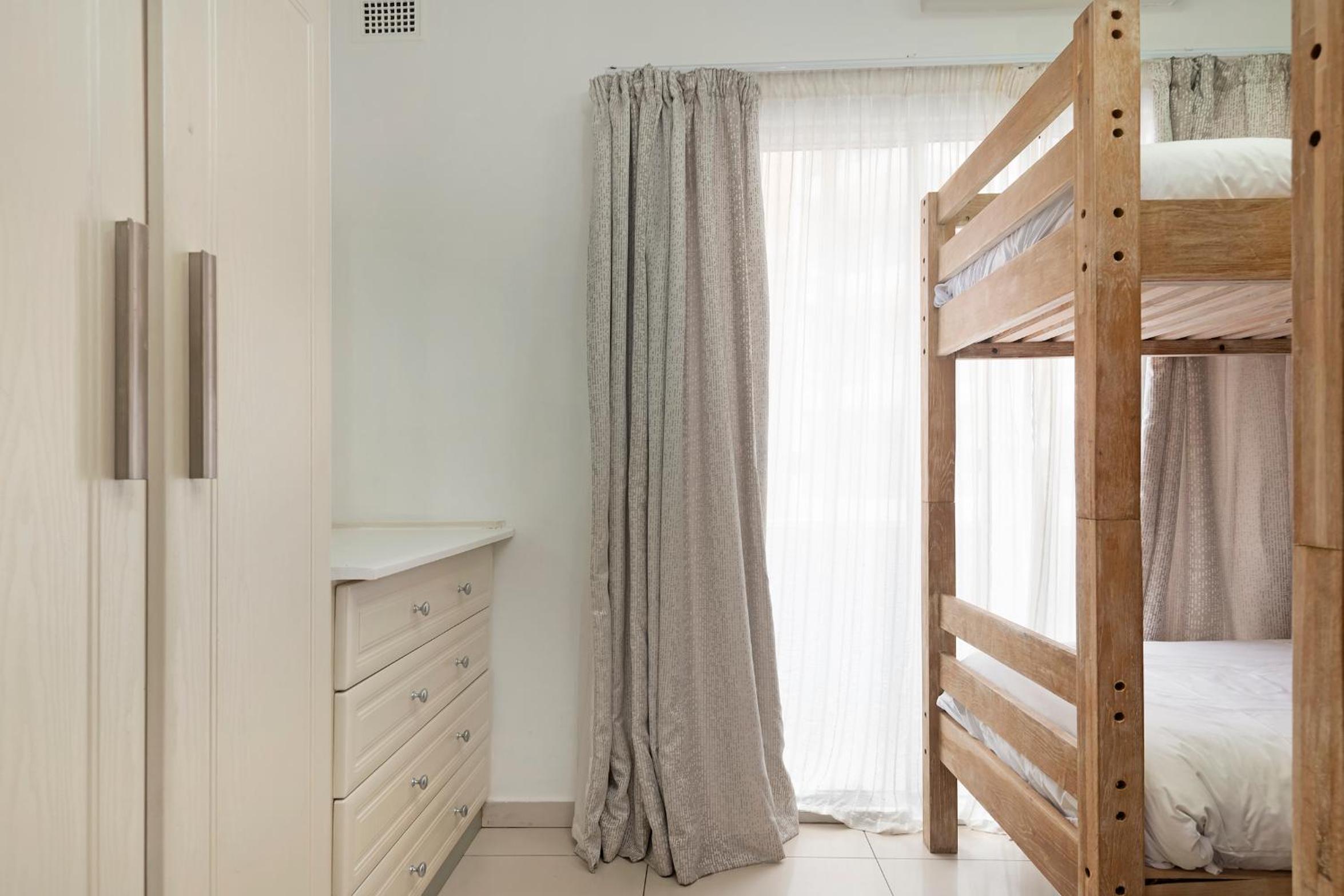 Three-Bedroom Apartment - Photo 16