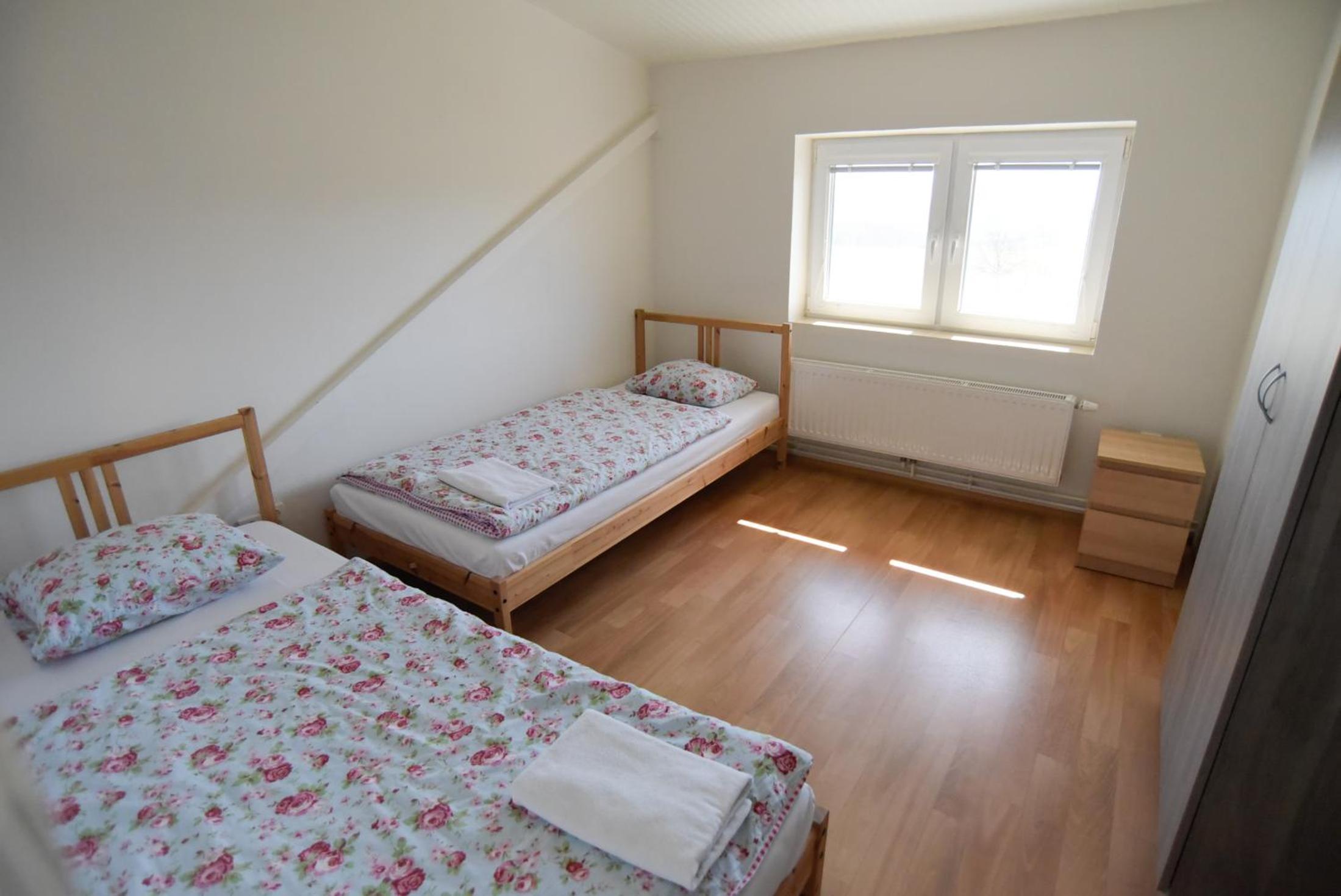 Three-Bedroom Apartment - Photo 32