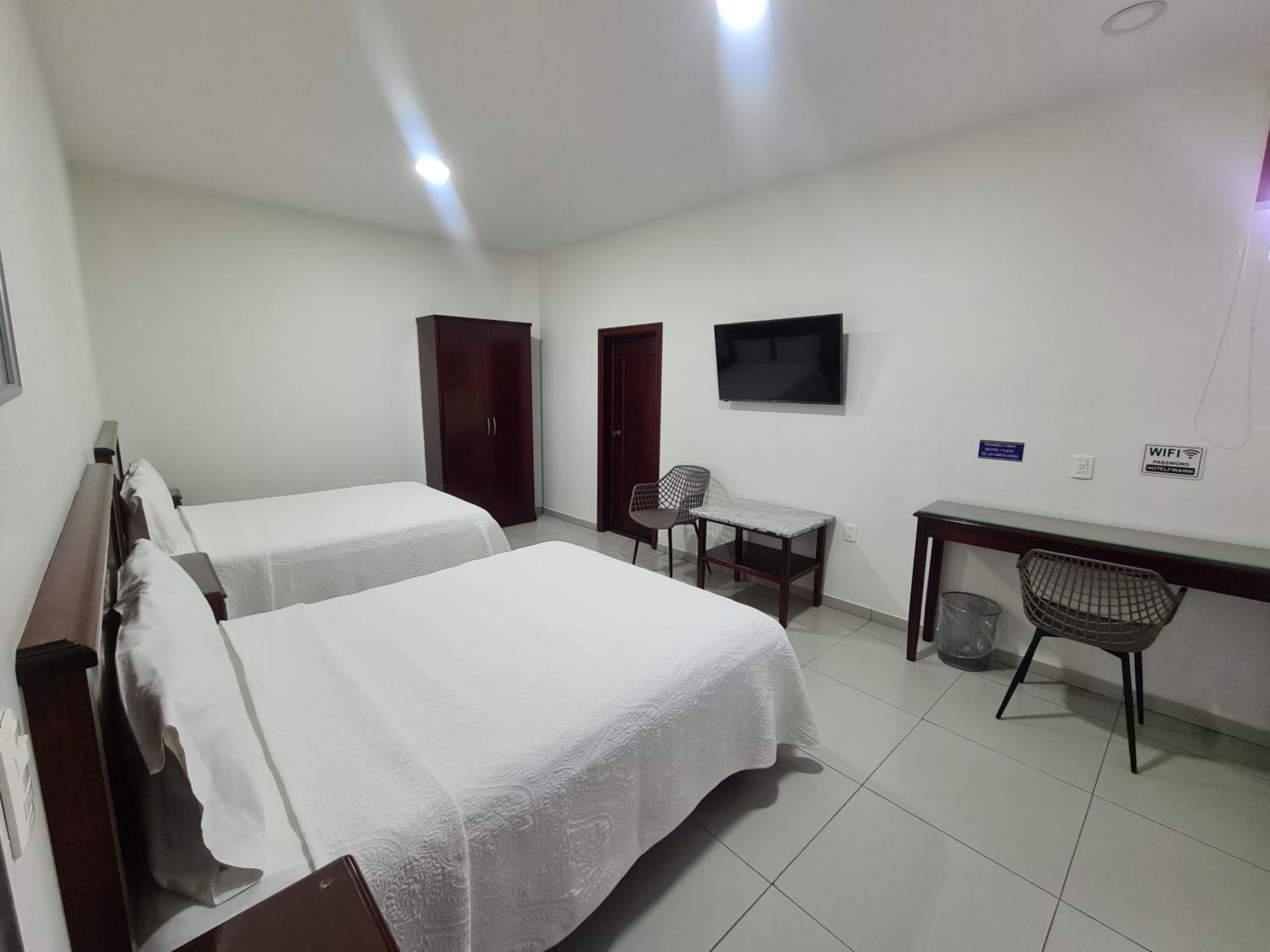 Deluxe Queen Room with Two Queen Beds photo 1