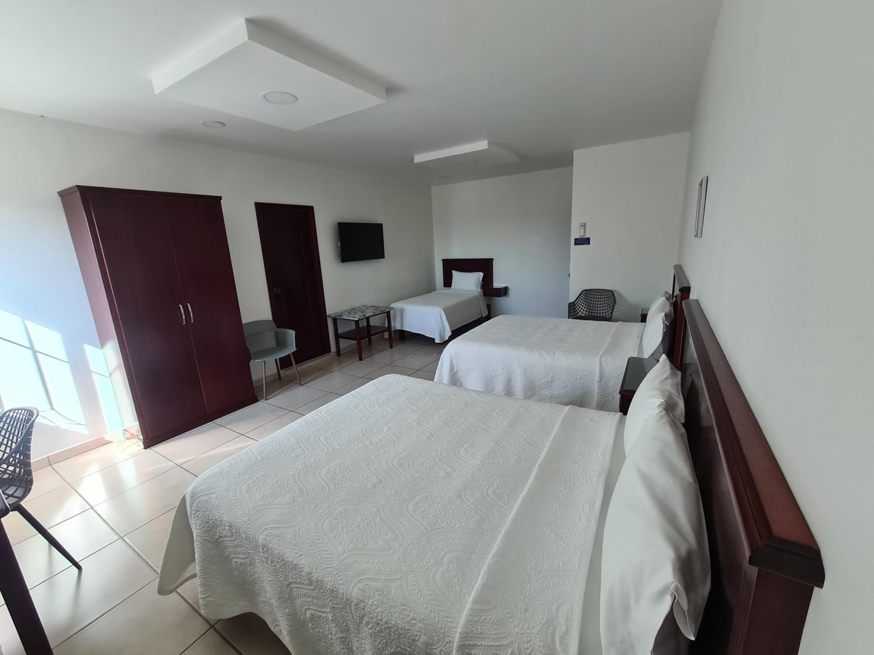 Deluxe Queen Room with Two Queen Beds photo 2