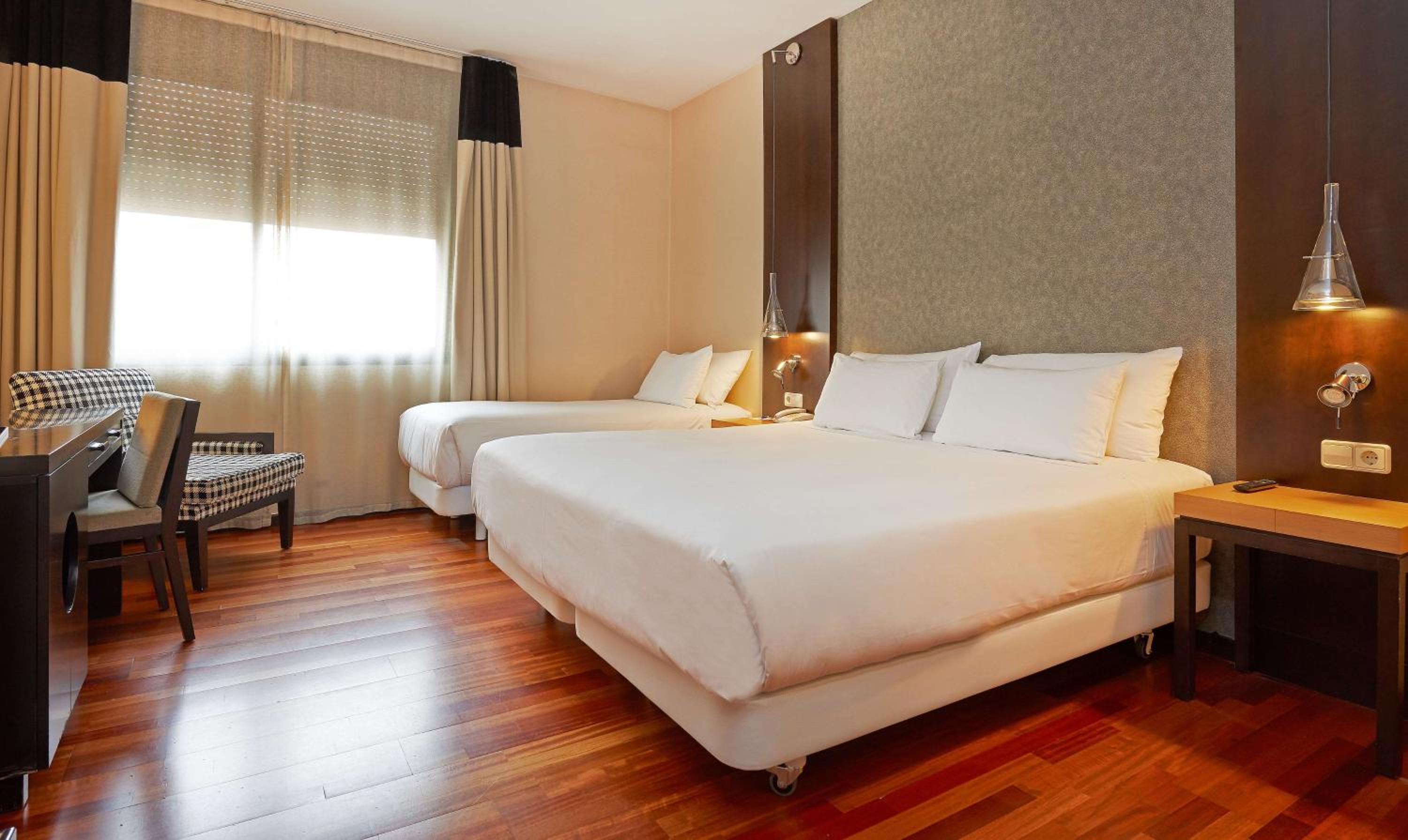 Family Adjoining Room (3 Adults + 1 Child)