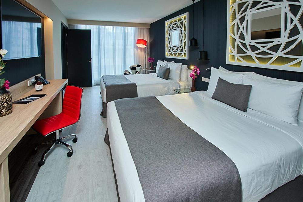 Deluxe Queen Room with Two Queen Beds - Photo 1