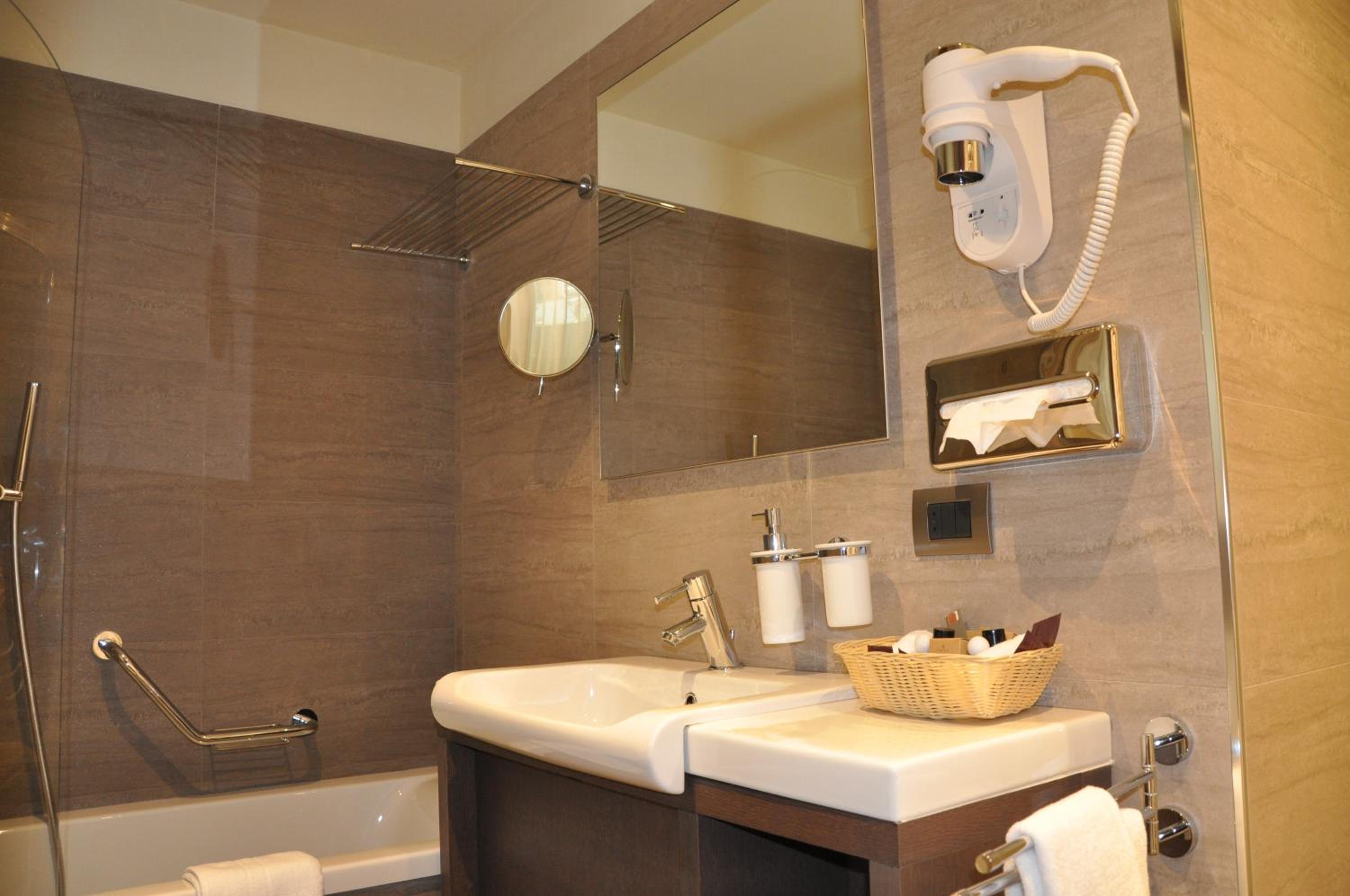 bathroom with a sink, toilet, and bathtub