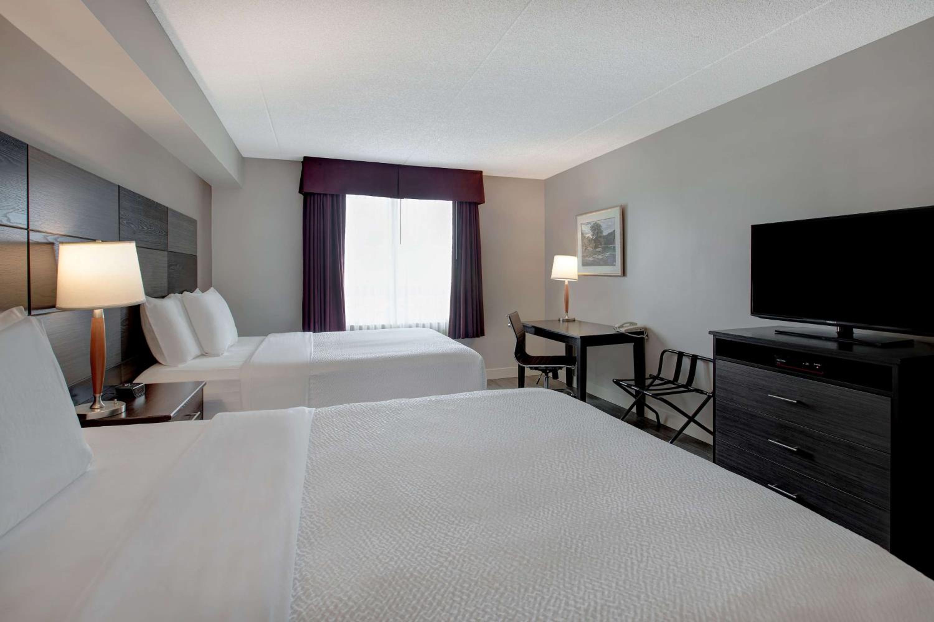 Queen Suite with Two Queen Beds and Sofa - Non-Smoking - Photo 1