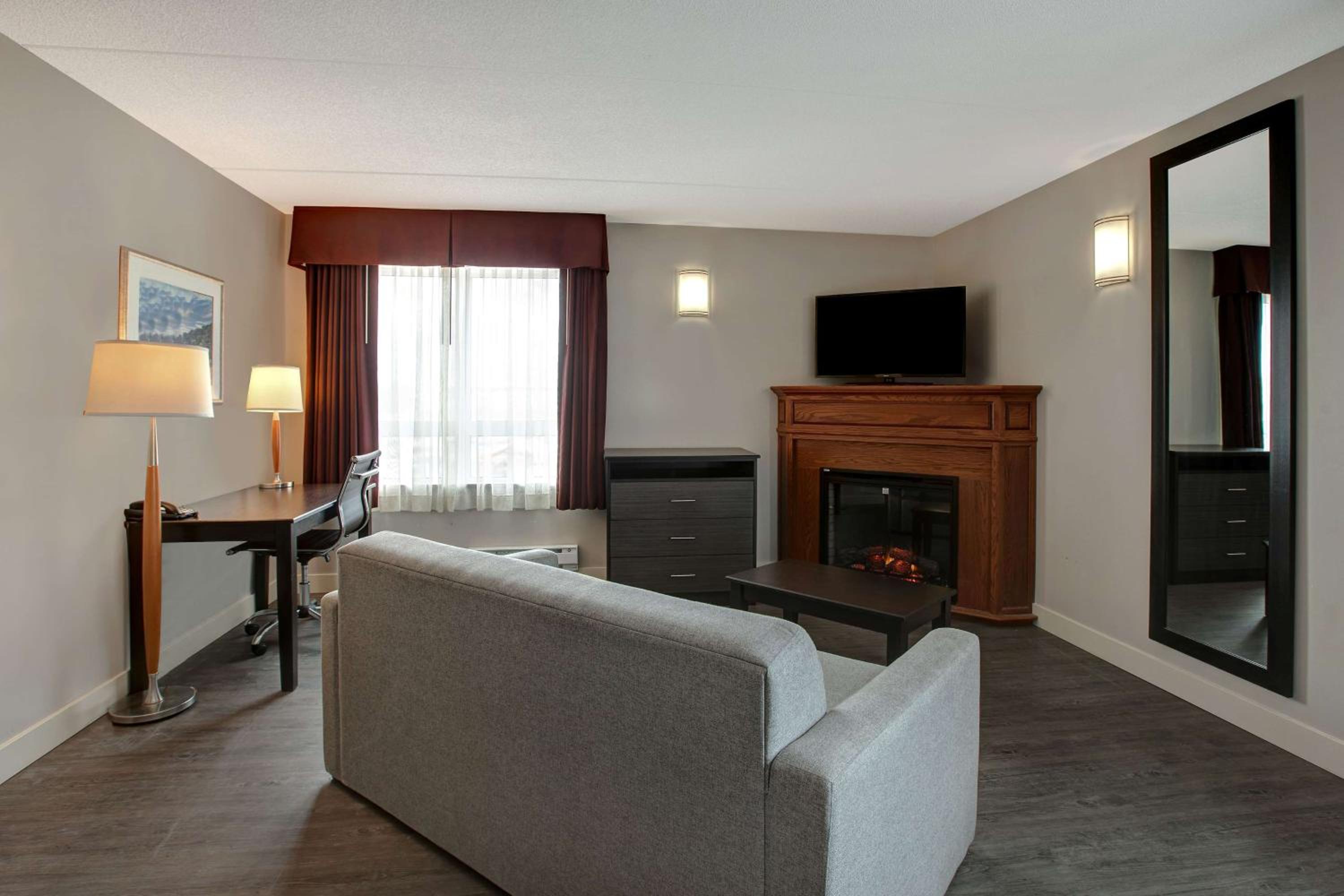 Deluxe Queen Suite with Two Queen Beds with Sofa Bed- Non-Smoking - Photo 1